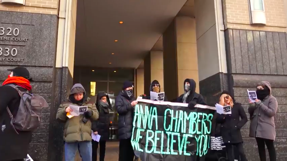 Metropolitan Anarchist Coordinating Council protests outside the Brooklyn Supreme Court. (Photo Credit: YouTube/Peter Eliscu)