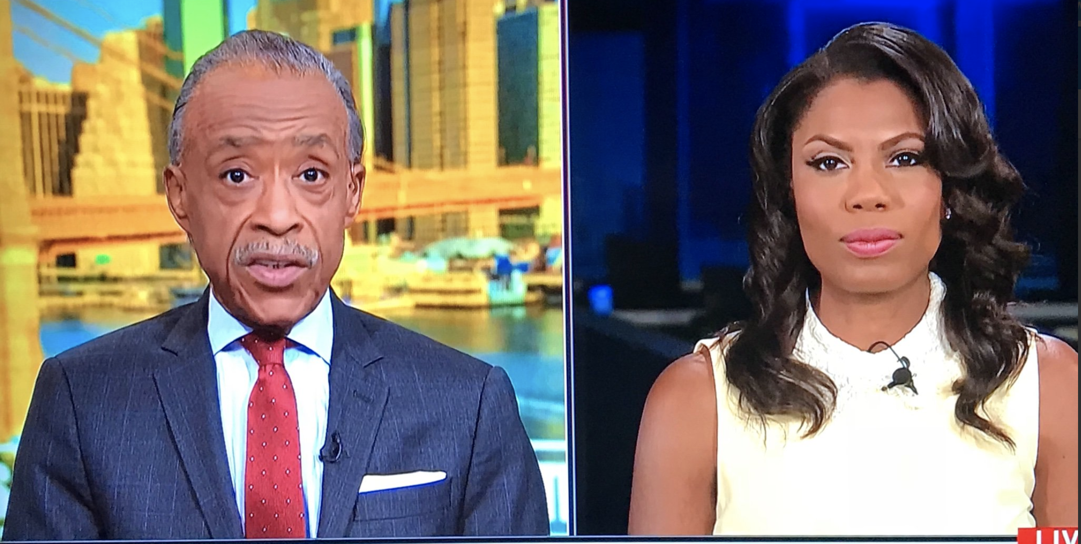 Screenshot of Reverend Al Sharpton on his MSNBC "Politics Nation" program interviewing former White House aide Omarosa Manigault Newman.