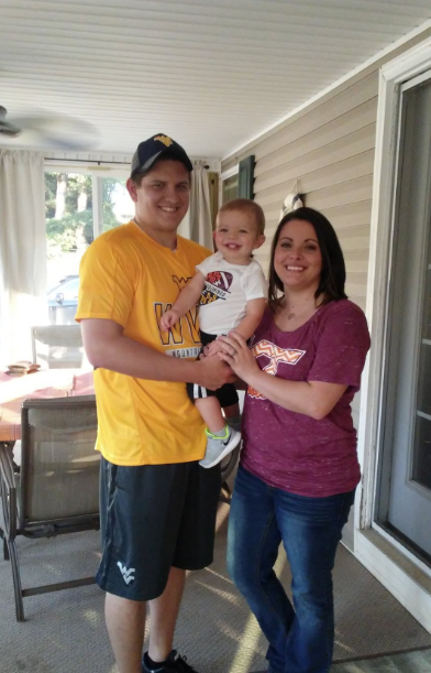 Robertson and his wife and child. Image via Twitter.