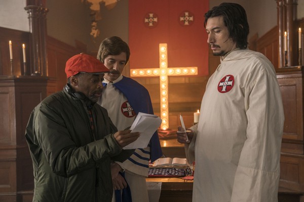 Director Spike Lee, left, with actors Topher Grace and Adam Driver on the set of "BlacKkKlansman." CREDIT: David Lee / Focus Features