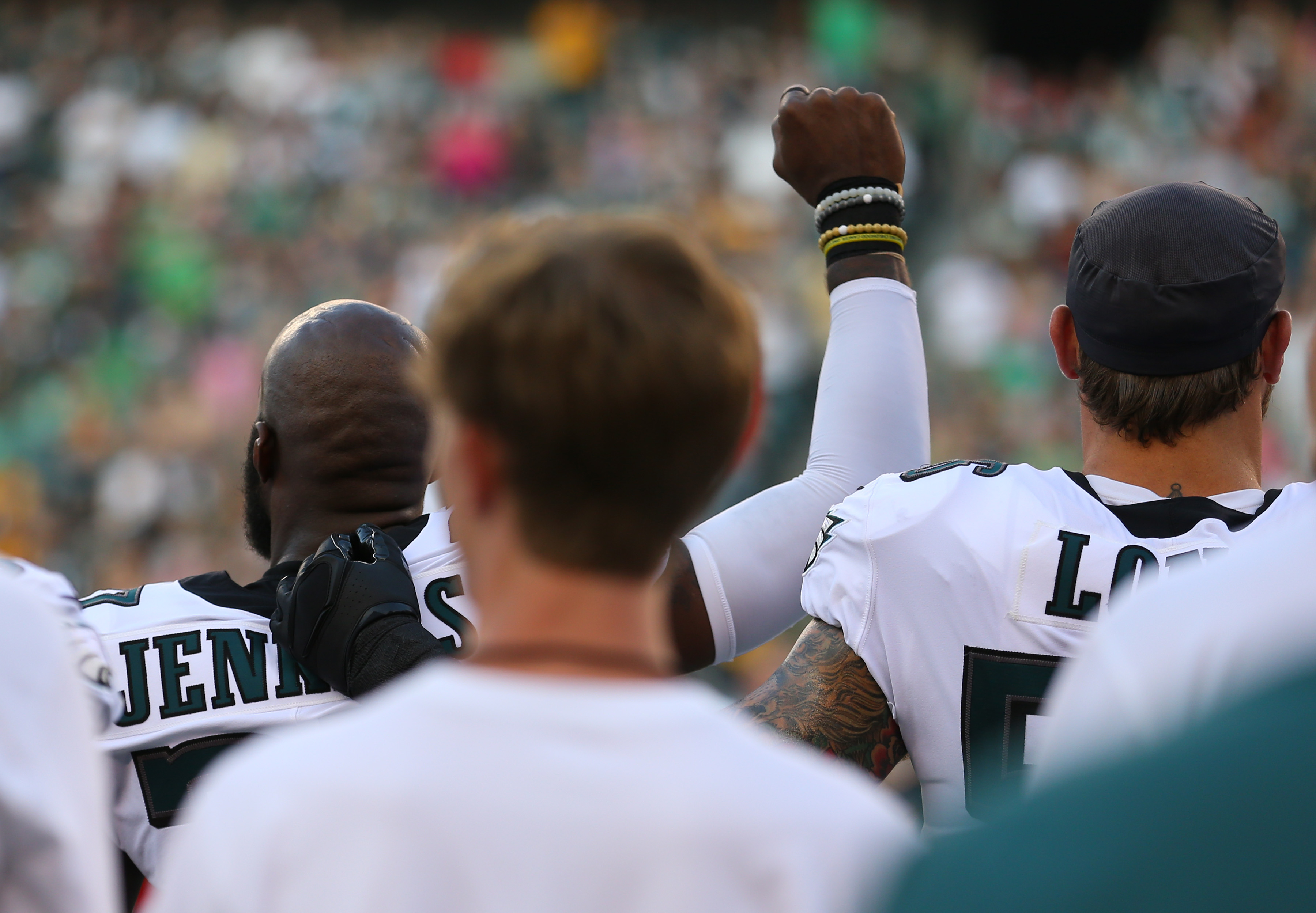 Malcolm Jenkins #27 of the Philadelphia Eagles raises his fist during the national anthem as Chris Long #56 puts his arm around him prior to the preseason game against the Pittsburgh Steelers. (Photo Credit: Mitchell Leff/Getty Images)