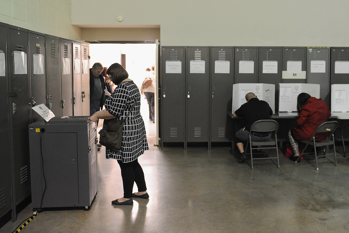 A voter casts her ballot at the Missouri National Guard Armory on November 8, 2016 in Lebanon, Missouri. CREDIT: Michael B. Thomas/Getty Images)