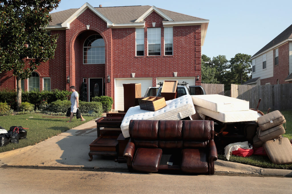 Damaged possession are left at the curb as residents recover from damage to their homes after torrential rains caused widespread flooding during Hurricane and Tropical Storm Harvey on September 1, 2017 in the Atascocita subdivision in Humble, Texas. (Credit Scott Olson/Getty Images)