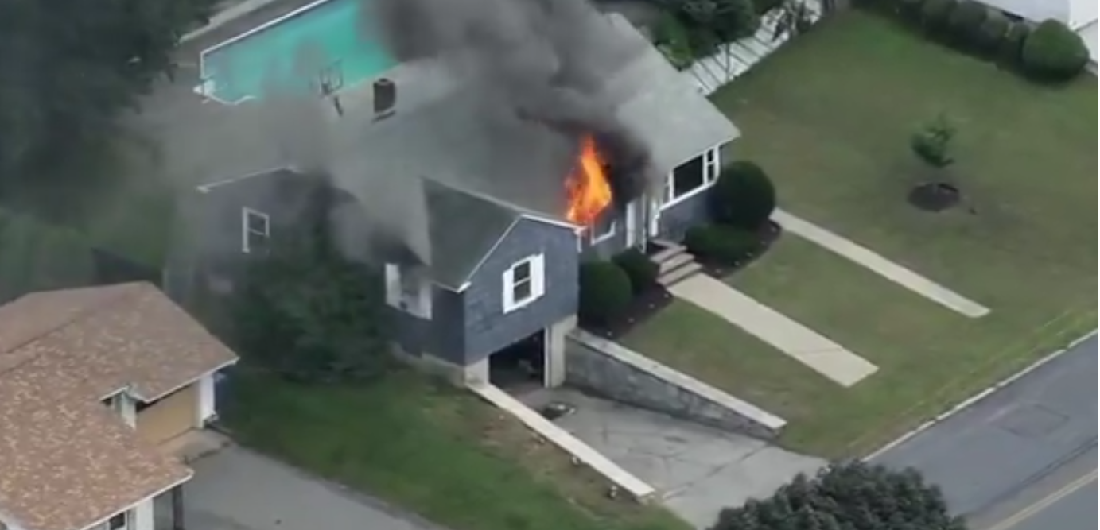 A house in Lawrence, Massachusetts burns after a suspected natural gas explosion on September 13, 2018. (Twitter/@NBC10)