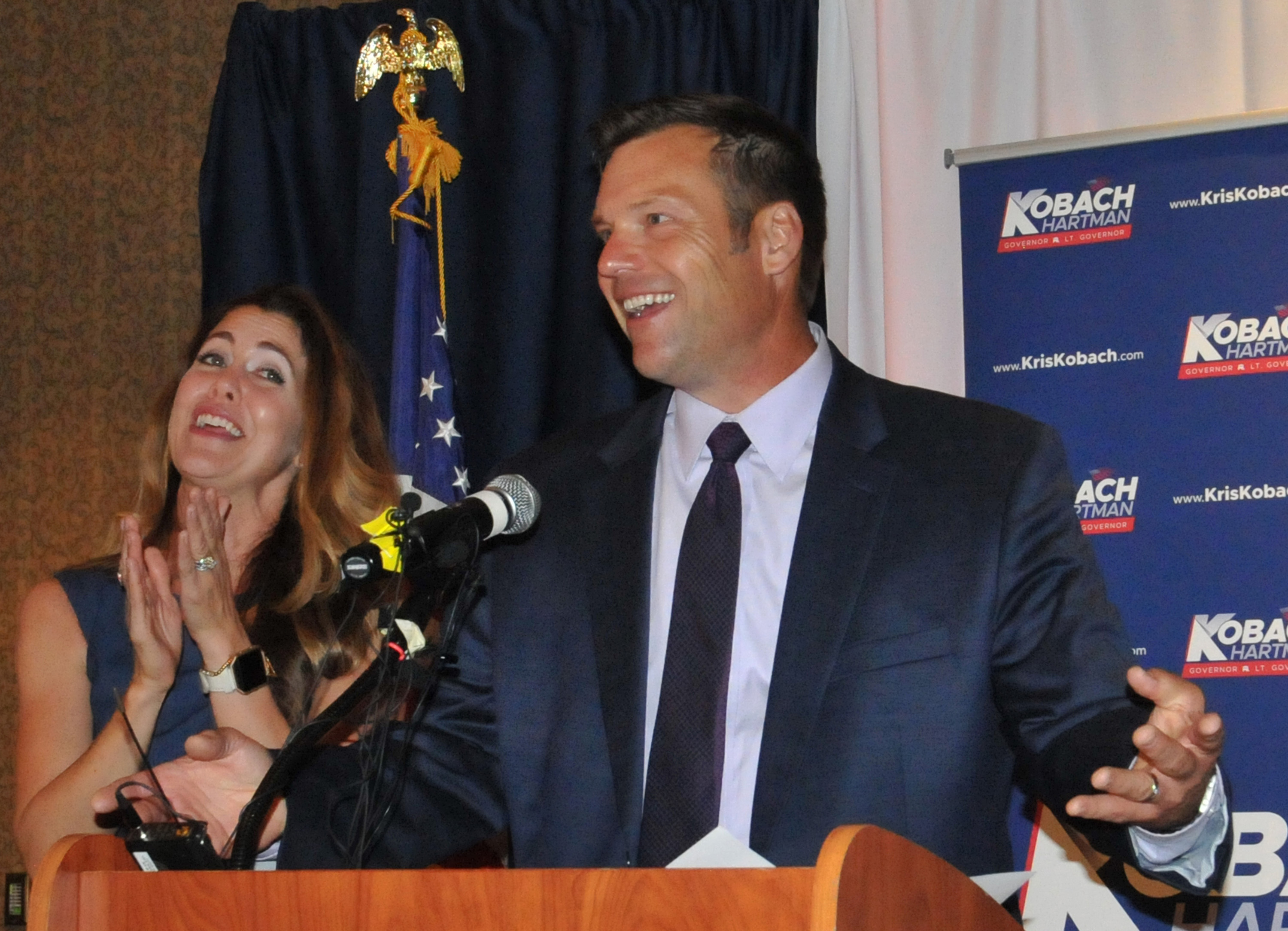 TOPEKA, KS - AUGUST 07: Republican primary candidate for Governor Kris Kobach, and his wife Heather Kobach speaks to supporters just after midnight in a tight race with Jeff Colyer that is too close to call. Kobach was supported by President Trump against incumbent Jeff Colyer on August 7, 2018 in Topeka, Kansas. (Photo by Steve Pope/Getty Images)