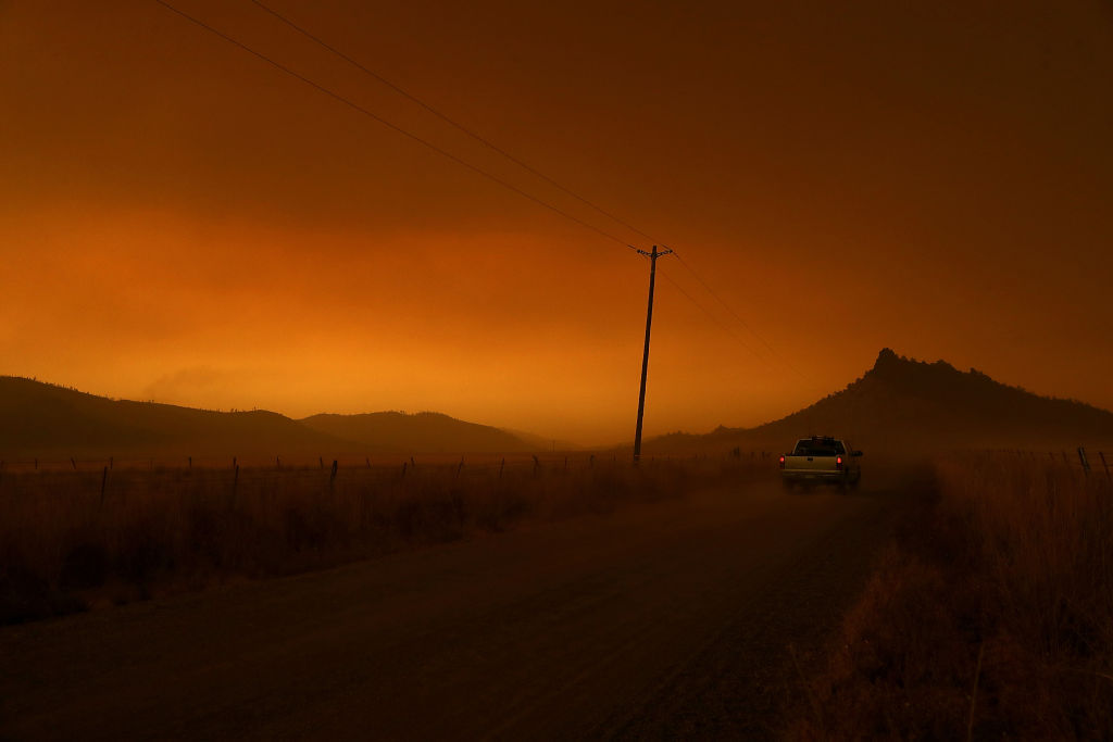 Smoke from the Mendocino Complex fire hangs over a valley on August 8, 2018 near Lodoga, California. (Credit: Justin Sullivan/Getty Images)