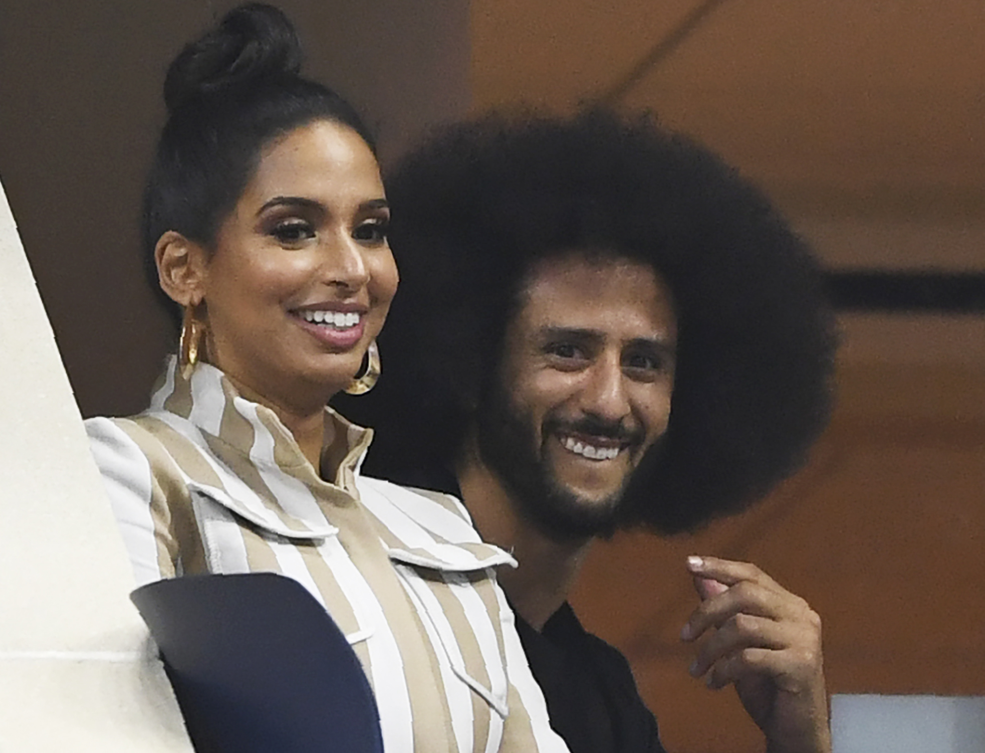Former NFL player Colin Kaepernick (C) attends the match between Venus Williams of the US and her sister Serena Williams of the US during their 2018 US Open women's round 3 match August 31, 2018 in New York. (Photo by Don EMMERT / AFP) (Photo credit should read DON EMMERT/AFP/Getty Images)