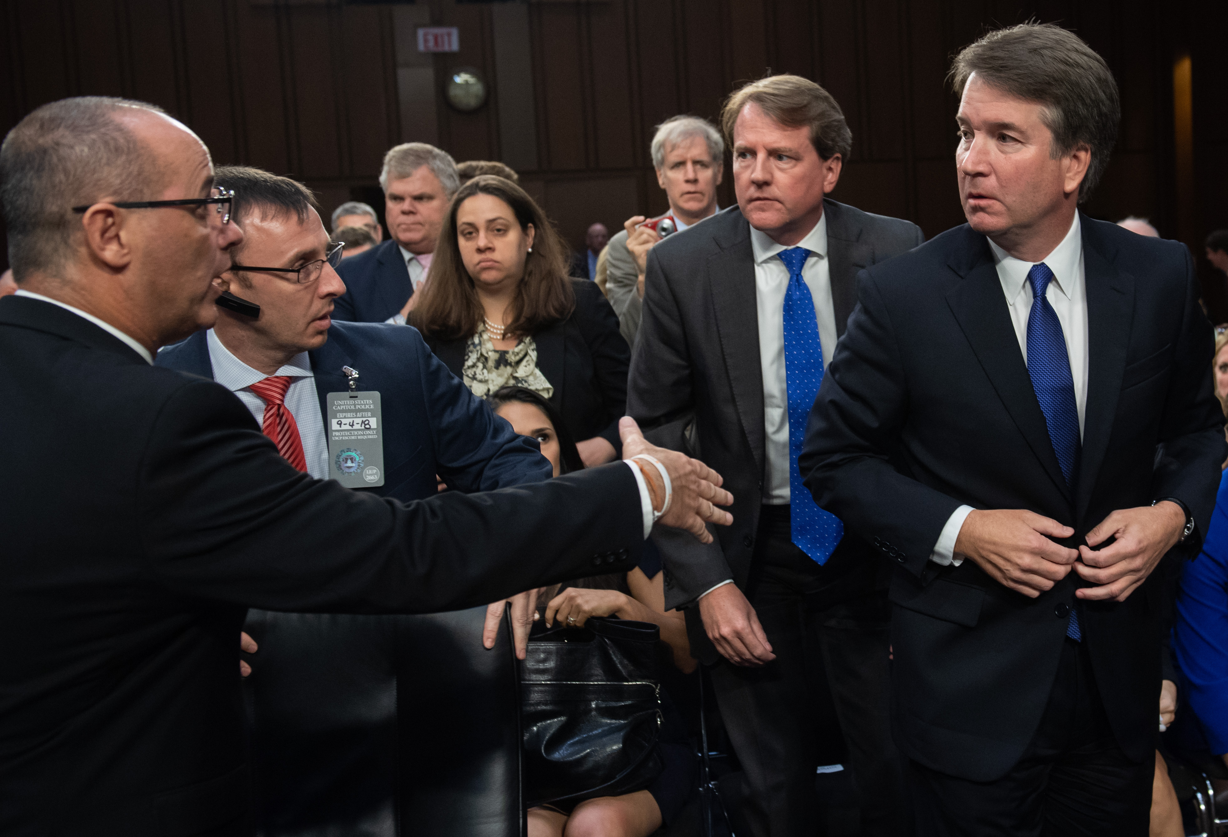 Fred Guttenberg (L), father of Parkland, Florida, shooting victim Jaime Guttenberg, tries to speak with Judge Brett Kavanaugh as he leaves for a break during his US Senate Judiciary Committee confirmation hearing to be an Associate Justice on the US Supreme Court, on Capitol Hill in Washington, DC, September 4, 2018. (Photo credit: SAUL LOEB/AFP/Getty Images)