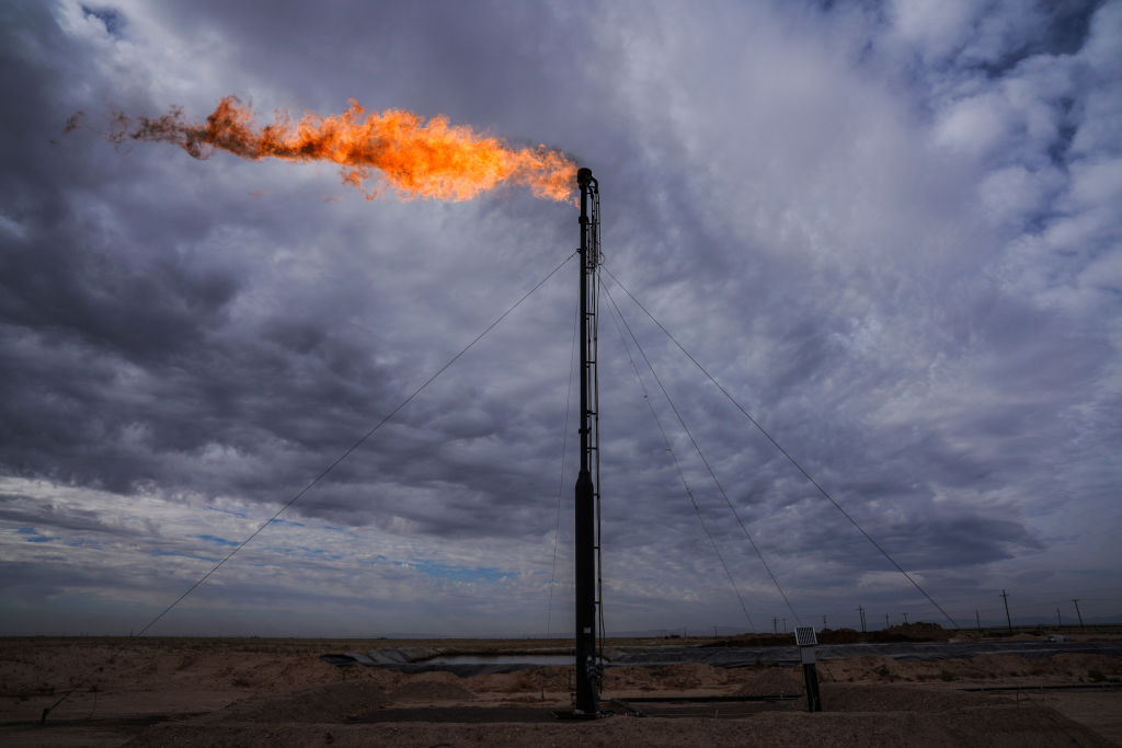Workers extracting oil from oil wells in the Permian Basin in Midland, Texas on May 3, 2018. CREDIT: Benjamin Lowy/Getty Images