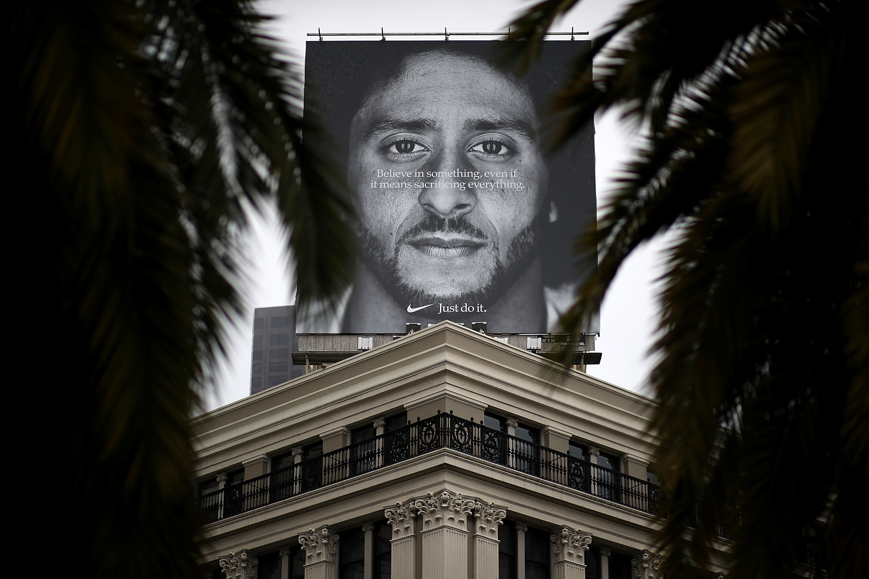 SAN FRANCISCO, CA - SEPTEMBER 05: A billboard featuring former San Francisco 49ers quaterback Colin Kaepernick is displayed on the roof of the Nike Store on September 5, 2018 in San Francisco, California. Nike launched an ad campaign to commemorate the 30th anniversary of its iconic "Just Do It' motto that features controversial former NFL quarterback Colin Kaepernick and a message that says "Believe in something. Even if it means sacrificing everything." (Photo by Justin Sullivan/Getty Images)