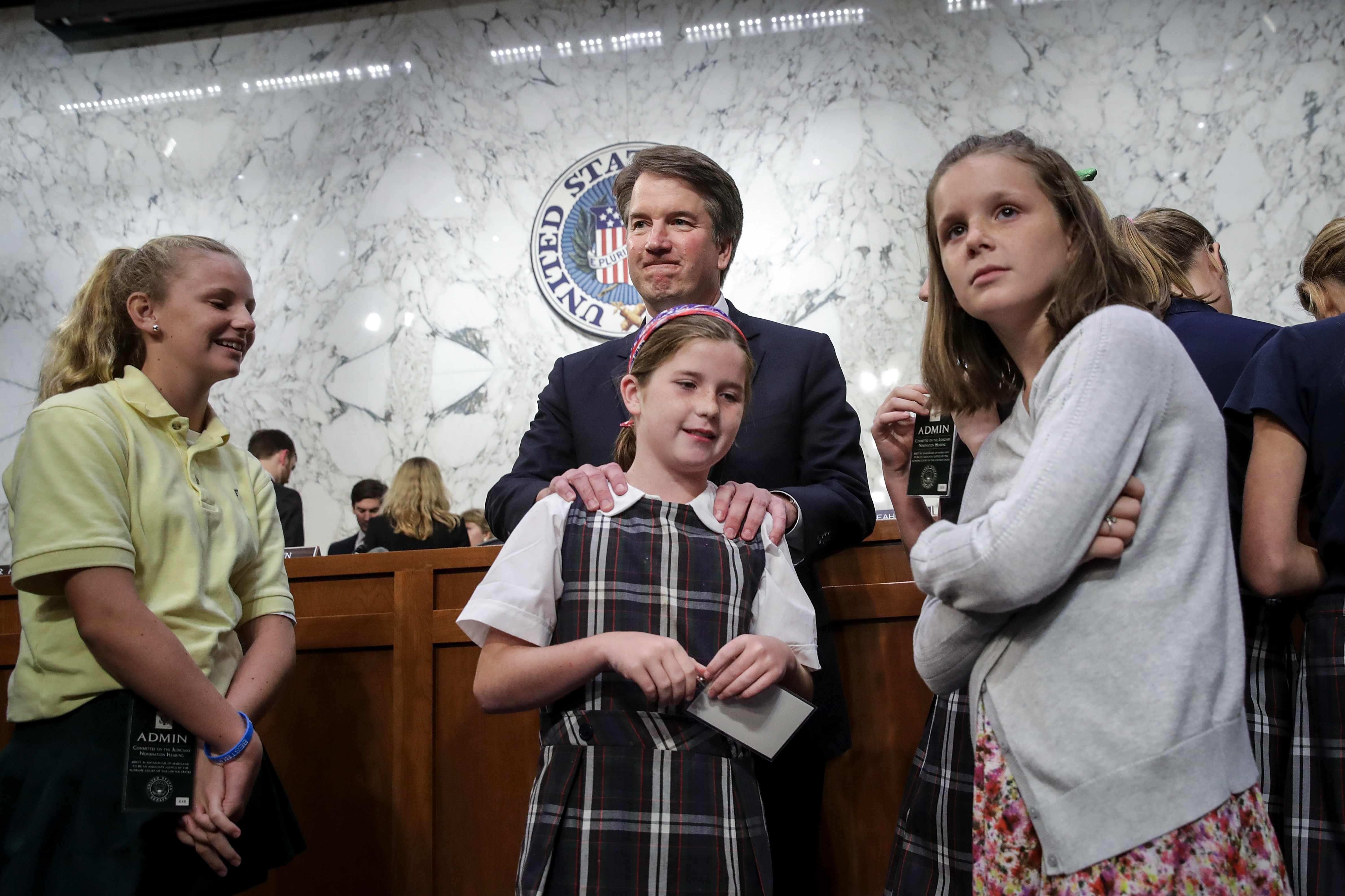 Supreme Court nominee Brett Kavanaugh stands with three young women who will lose their right to an abortion if he is confirmed to the Supreme Court. (Photo by Drew Angerer/Getty Images)