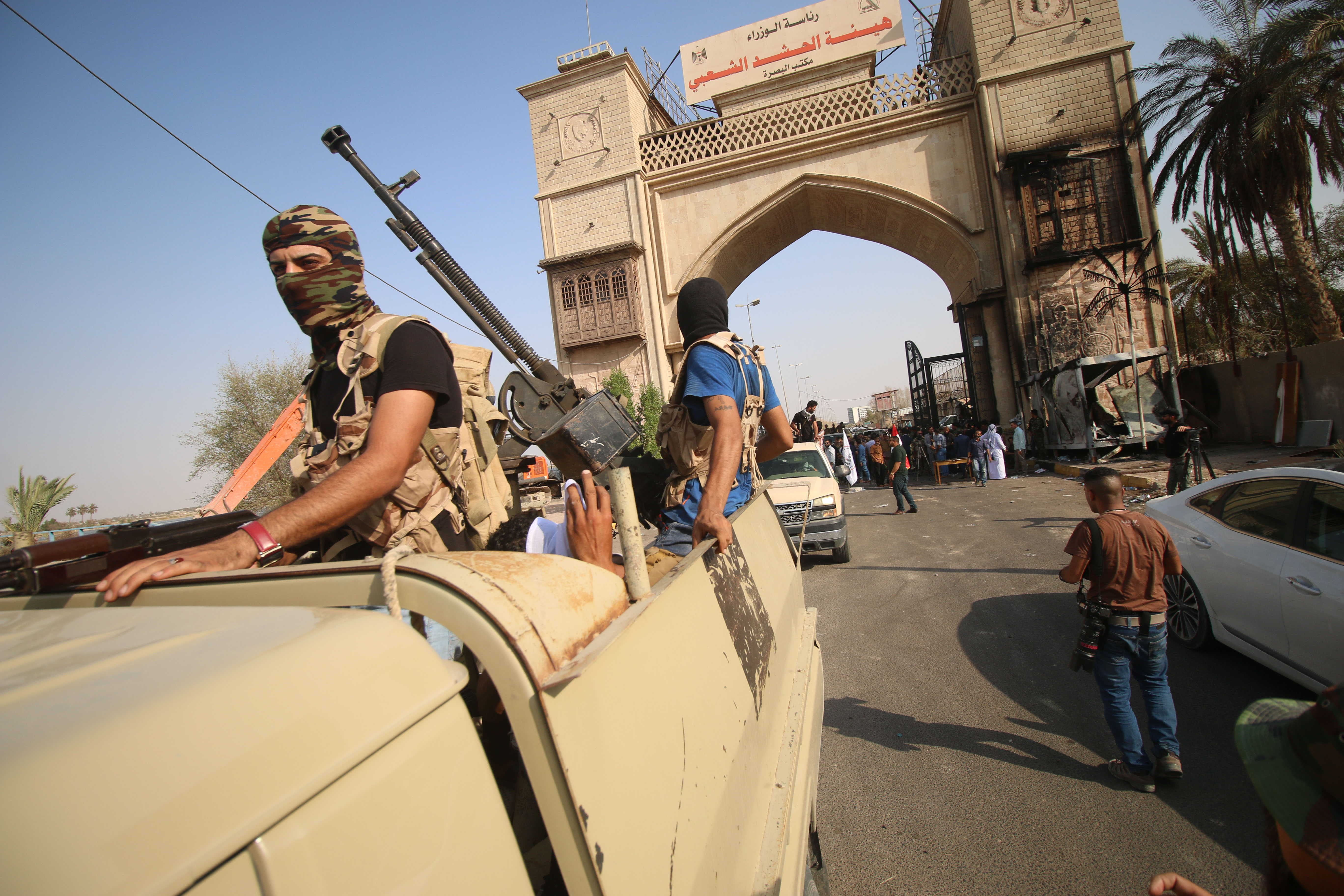 Iraqi special forces members patrol in a street in Basra after Iraq's Joint Operations Command, which includes the army and police, vowed a "severe" response with "exceptional security measures", including a ban on protests and group travel. CREDIT: Haidar Mohammad Ali/AFP/Getty Images.