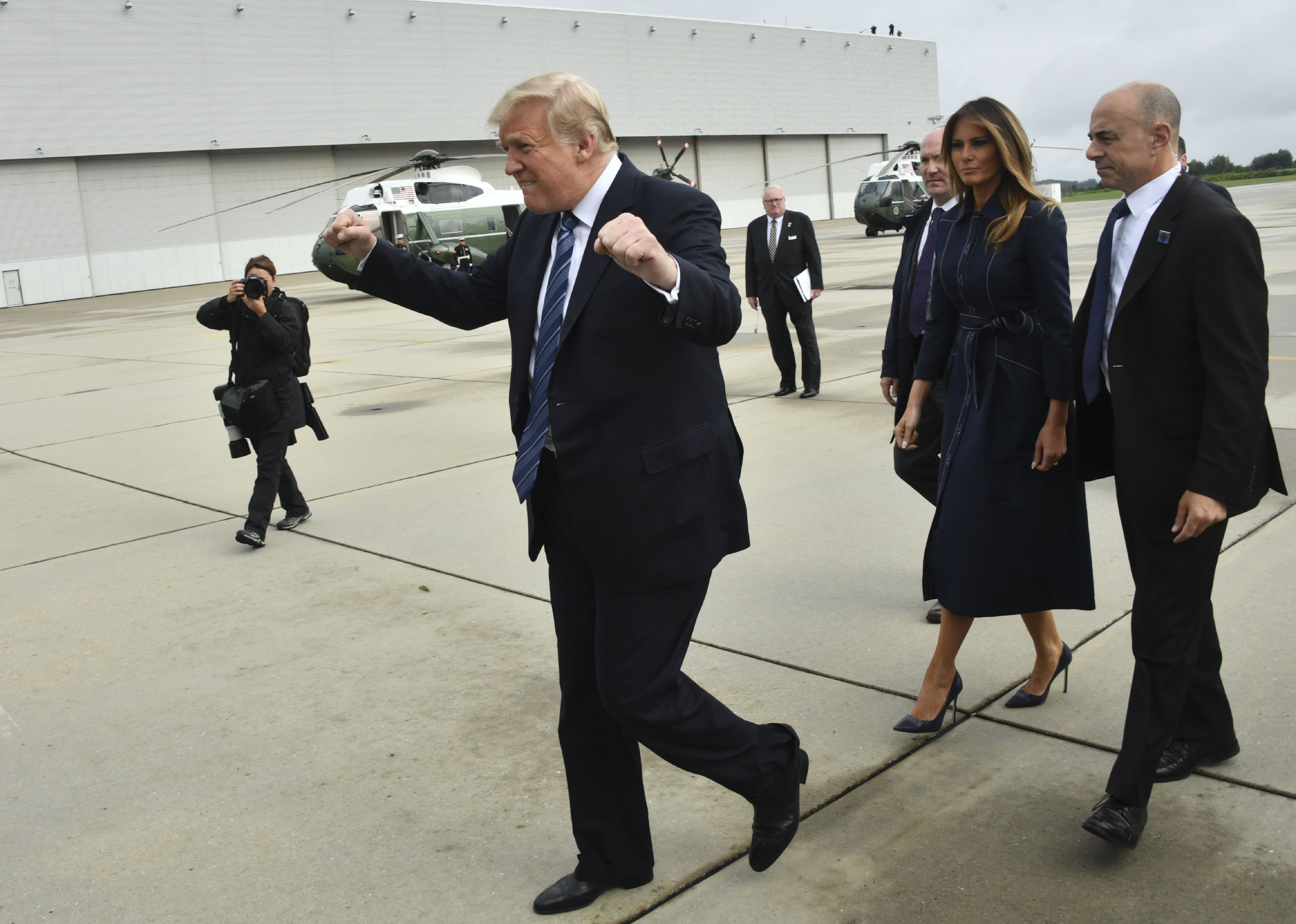 Trump gestures as he arrives in Pennsylvania with First Lady Melania Trump on Tuesday en route to a 9/11 memorial event. (CREDIT: Nicholas Kamm / AFP)