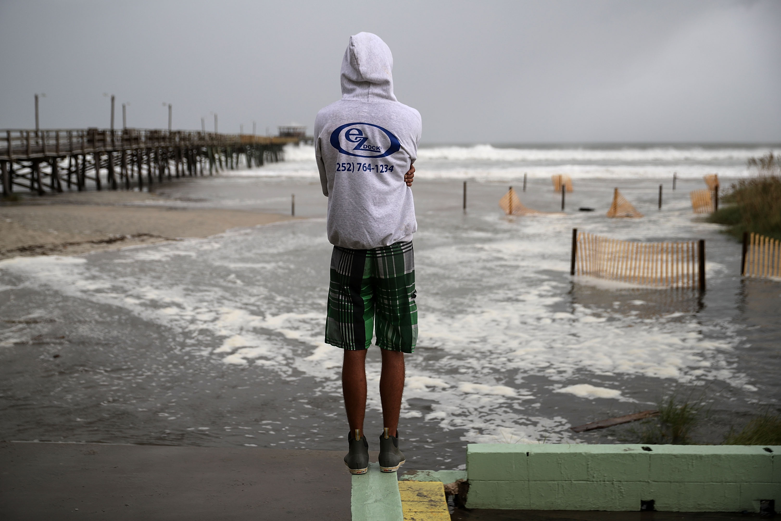 Water rolls up the beach near the Oceana Pier at high tide as the outer edges of Hurricane Florence being to affect the coast September 13, 2018 in Atlantic Beach, United States. CREDIT: Chip Somodevilla/Getty Images