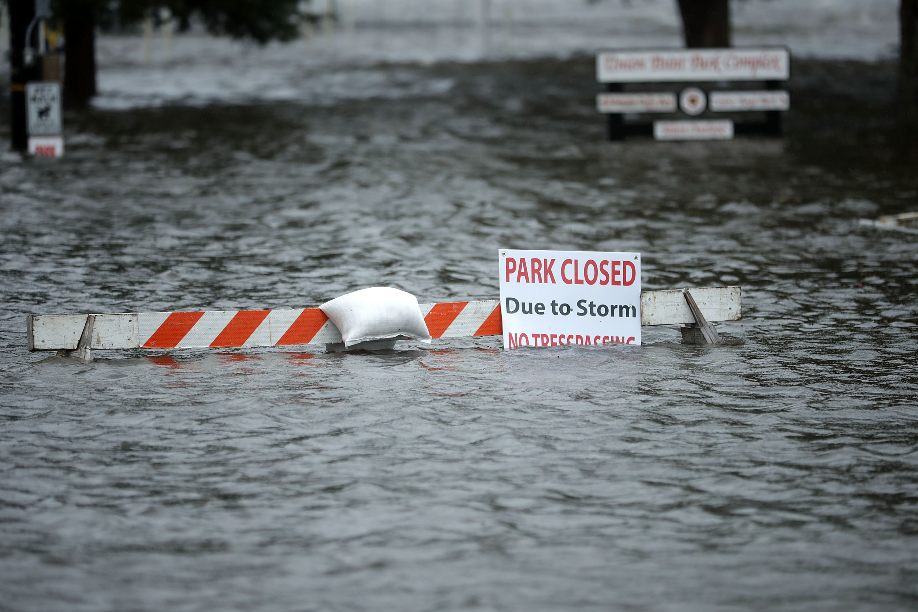 A sign warns people away from Union Point Park after is was flooded by the Neuse River during Hurricane Florence September 13, 2018 in New Bern, North Carolina. (Credit: Somodevilla/Getty Images)