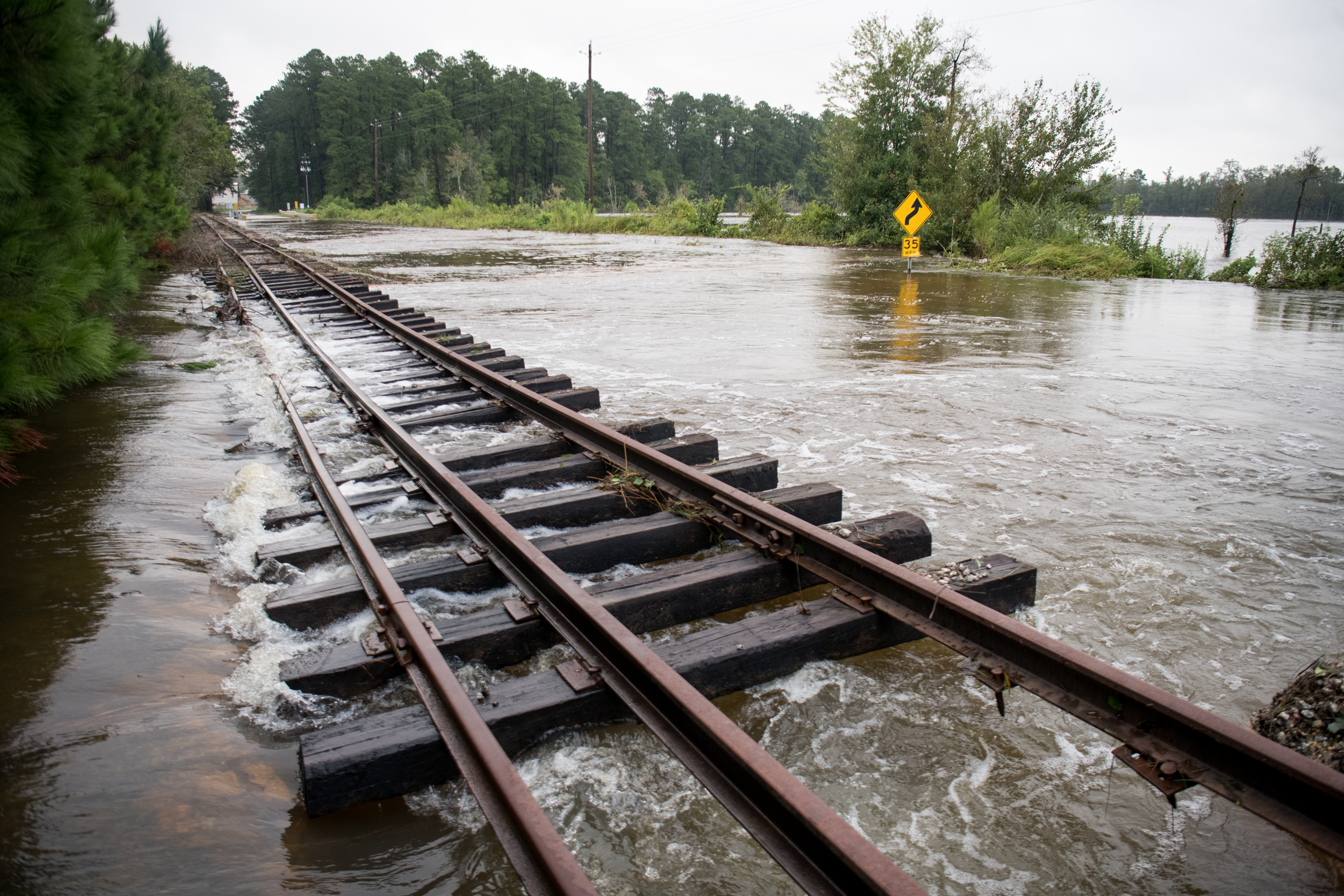 Floodwaters damage railroad tracks and cover a road after Hurricane Florence struck the Carolinas September 17, 2018, in Wallace, South Carolina. CREDIT: Sean Rayford/Getty Images