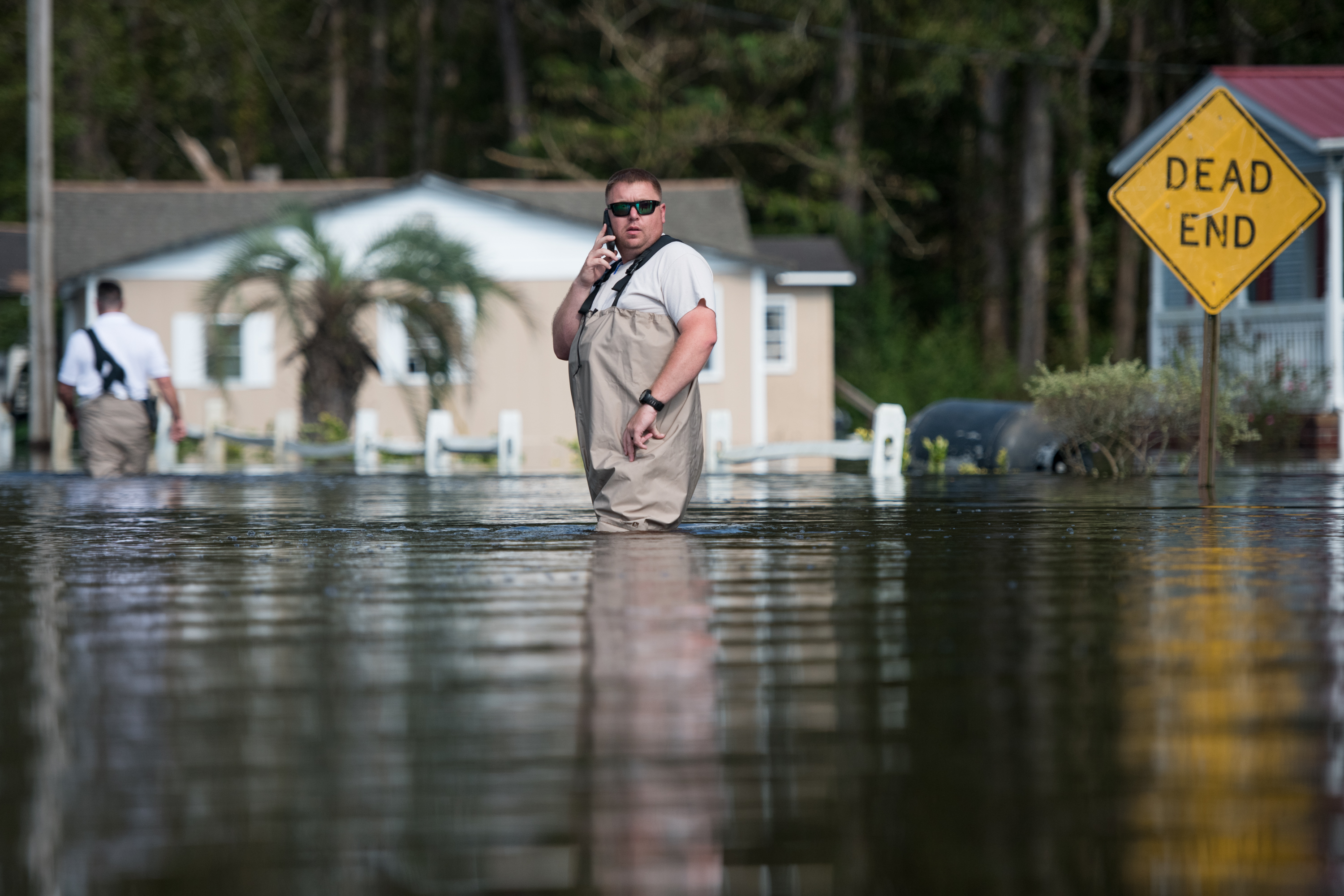 A South Carolina Law Enforcement agent checks for stranded residents in floodwaters caused by Hurricane Florence near the Todd Swamp on September 21, 2018 in Longs, South Carolina. (Credit: Sean Rayford/Getty Images)