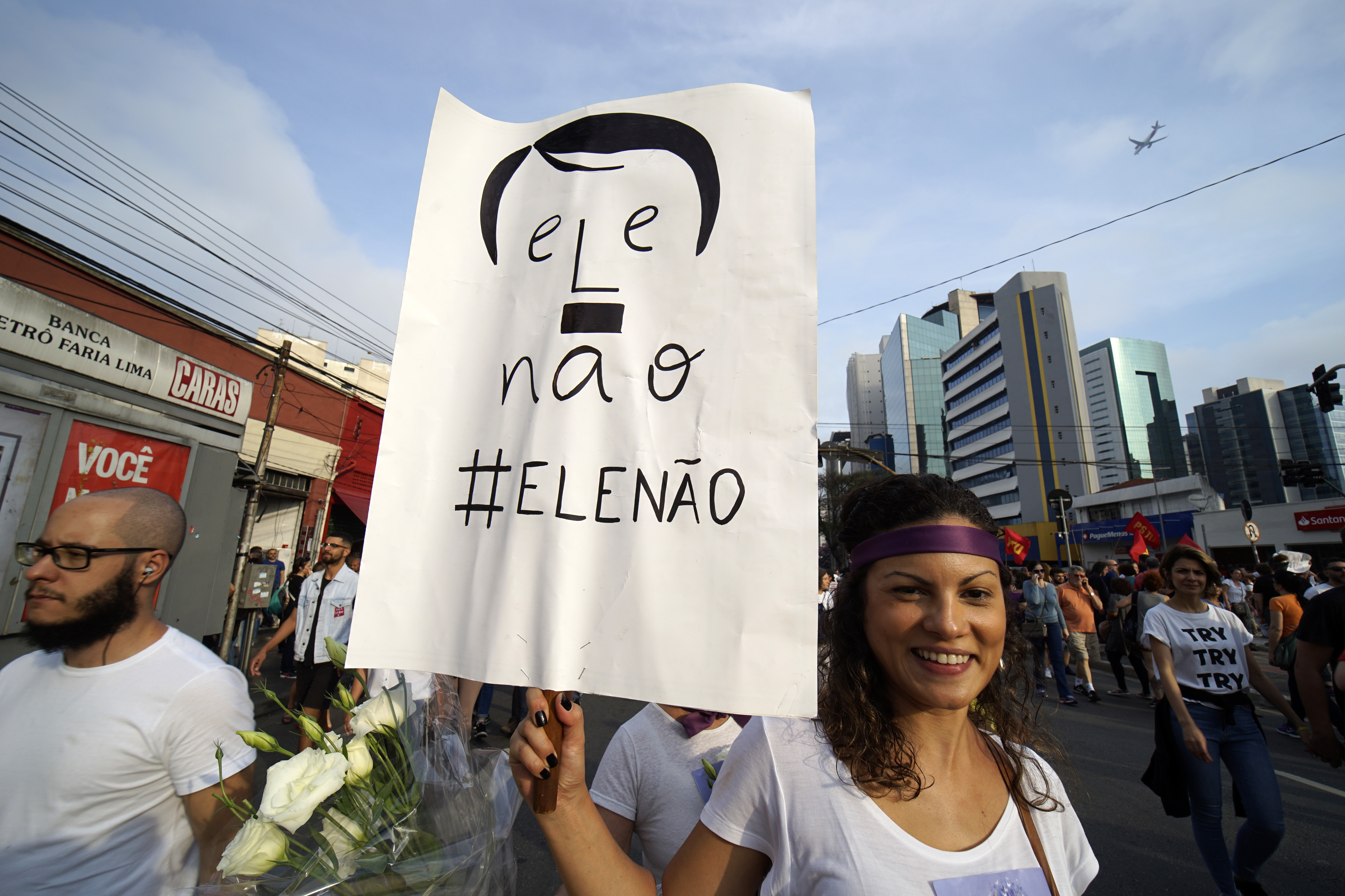 Women protest against the far-rights presidential candidate on September 29, 2018 in Sao Paulo, Brazil. The protests occurred simultaneously in several Brazilian cities, against Jair Bolsonaro, the far rights presidential candidate. Protests included an internet campaign (#elenão and #himnot) which was joined by many women from various countries. Corinthians fans, Brazil's biggest soccer team, and other social groups also joined. (Photo by Cris Faga/NurPhoto via Getty Images)