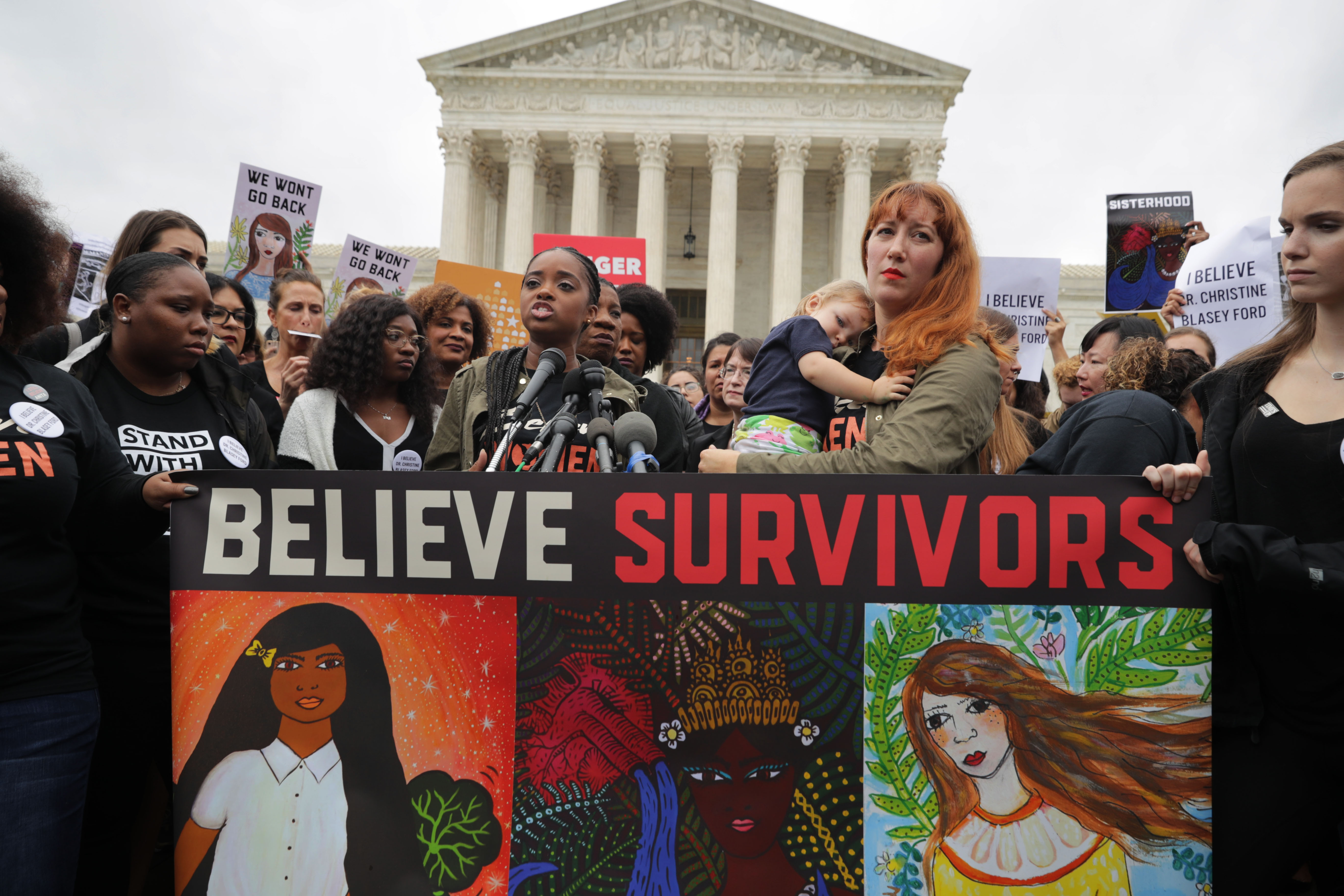WASHINGTON, DC - SEPTEMBER 24: Women’s March co-president Tamika Mallory (at microphones) and Women's March on Washington creator Bob Bland (2nd-R) address a rally against the confirmation of Supreme Court nominee Judge Brett Kavanaugh in front of the court September 24, 2018 in Washington, DC. Hundreds of people from half a dozen progressive organizations, including students from Yale University Law School, protested on Capitol Hill for a #BelieveSurvivors Walkout against Judge Kavanaugh, who has been accused by at least two women of sexual assault. (Photo by Chip Somodevilla/Getty Images)