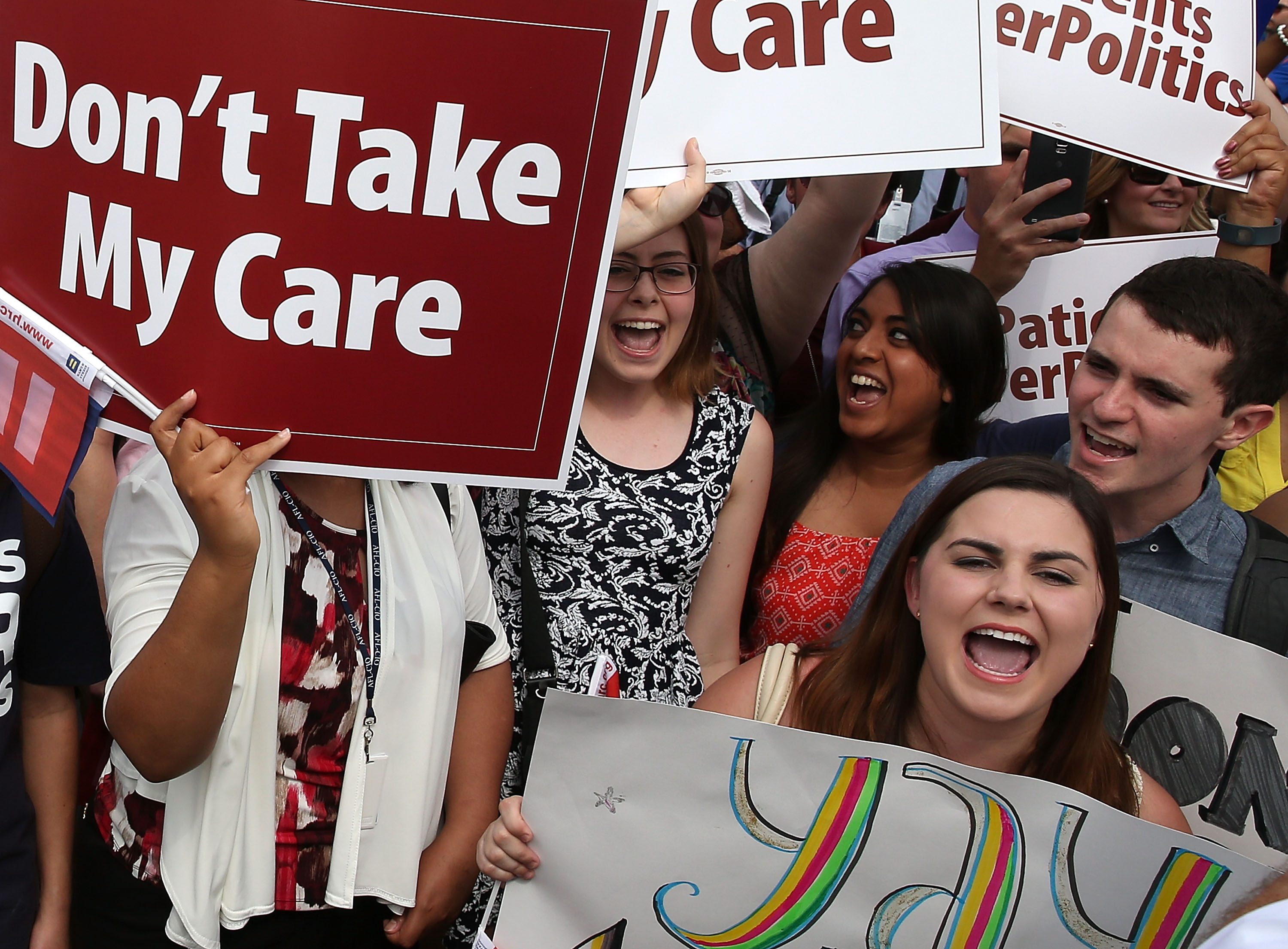 WASHINGTON, DC - JUNE 25: People celebrate in front of the US Supreme Court after ruling was announced on the Affordable Care Act. June 25, 2015 in Washington, DC. The high court ruled that the Affordabvle Care Act may provide nationwide tax subsidies to help poor and middle-class people buy health insurance.Ê (Photo by Mark Wilson/Getty Images)
