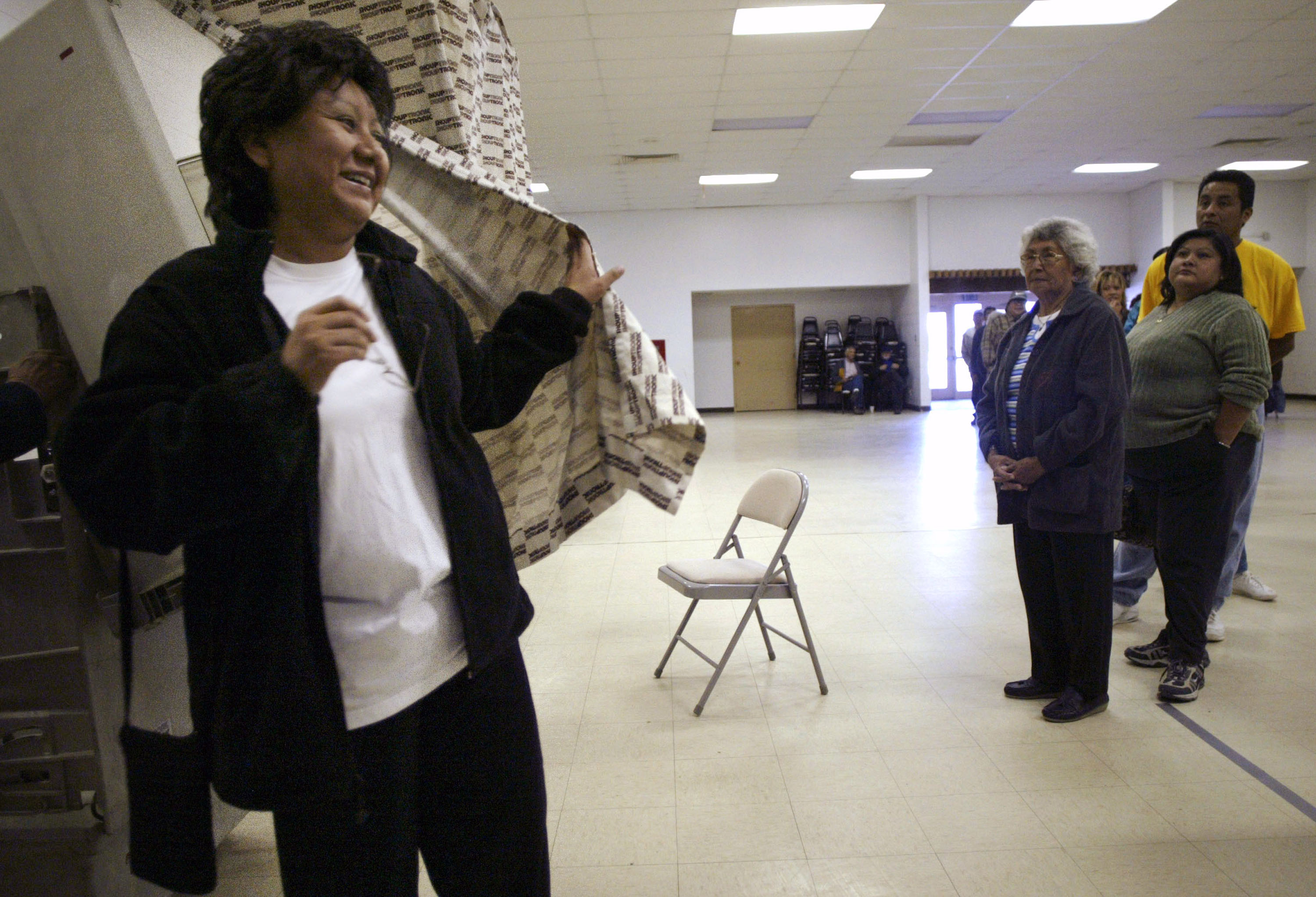 Sharon Lewis, a member of the Pueblo of Acoma, breathes a sigh of relief after finally casting her ballot at the Acoma Tribal Center in Acoma, New Mexico. (Photo by Rick Scibelli/Getty Images)