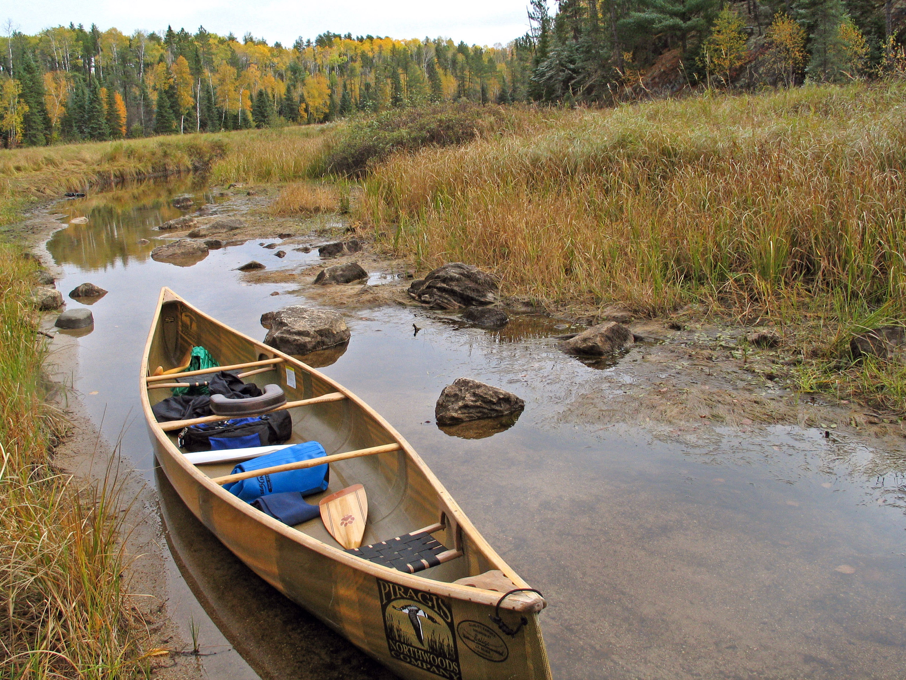 ELY, MN - OCTOBER 7: A canoe rests in shallow water at the Mudro Lake access point in the Boundary Waters Canoe Area October 7, 2005 near Ely, Minnesota. (Photo by Jeffrey Phelps/Getty Images)