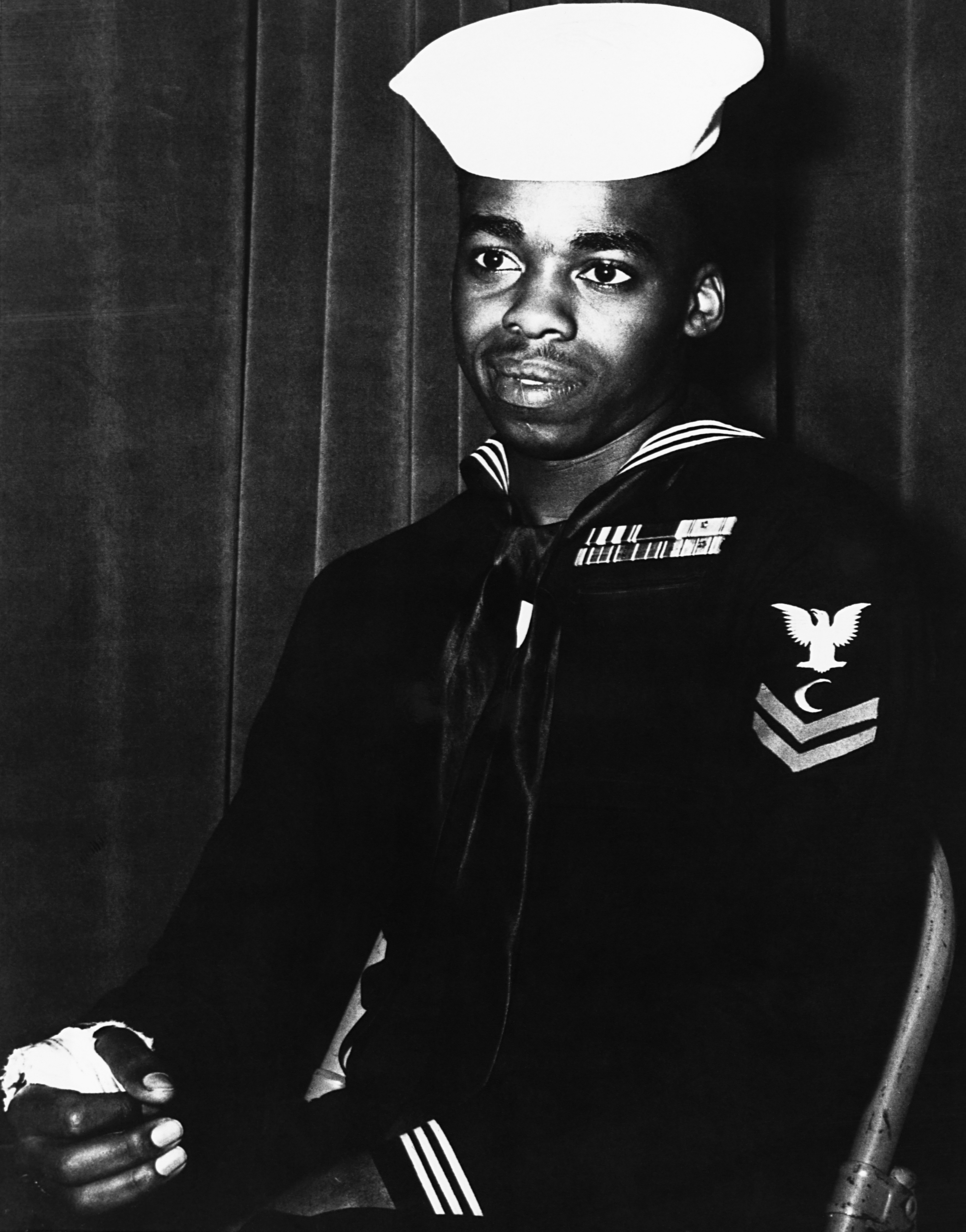 Ship's cook third class Dorie Miller was decorated for firing at Japanese aircraft on his own initiative during the attack on Pearl Harbor. (Photo by © CORBIS/Corbis via Getty Images)