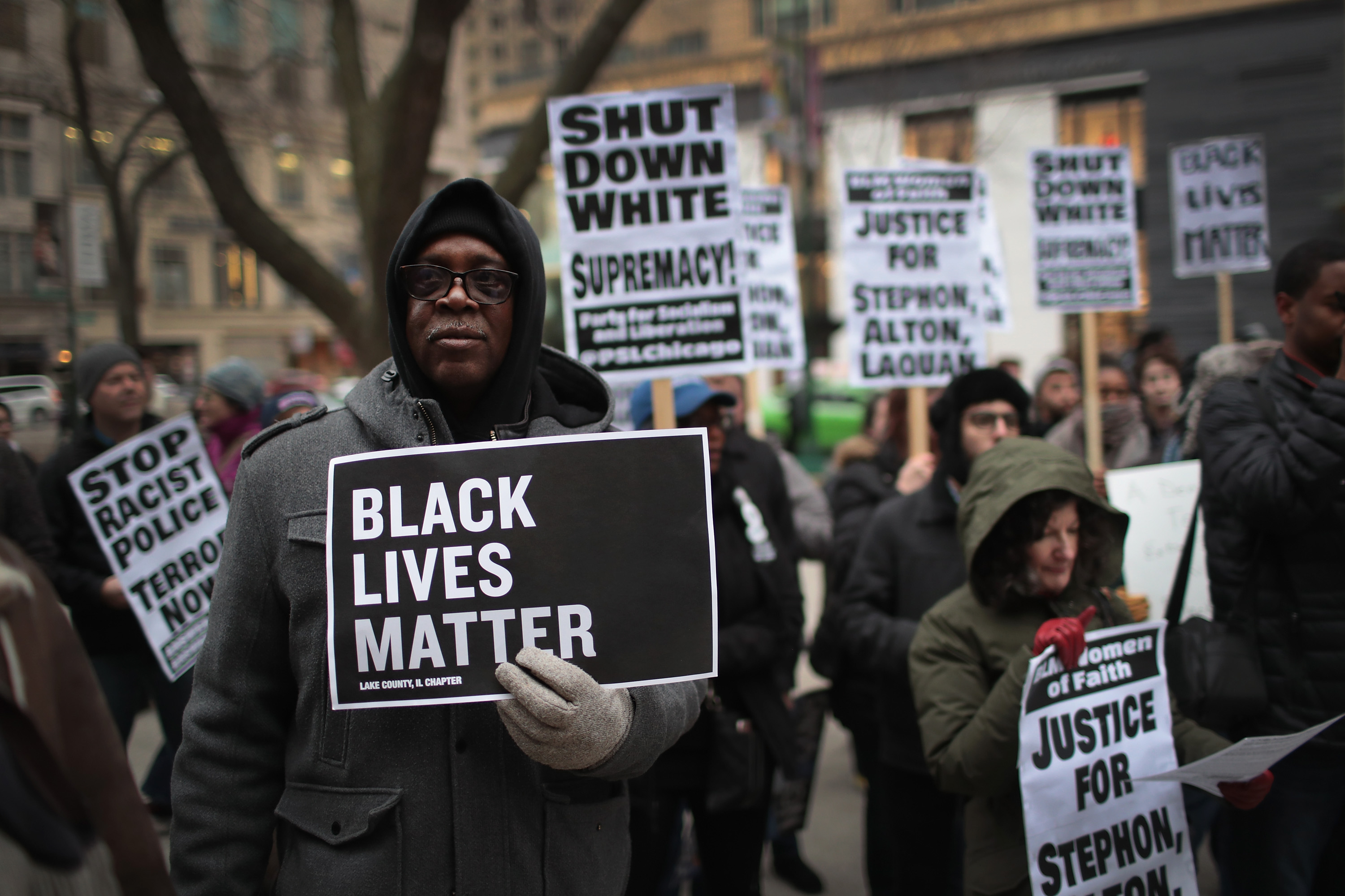 In recognition of the 50th anniversary of the death of Dr. Martin Luther King Jr., and in solidarity with the family and supporters of Stephon Clark and others killed by police, demonstrators protest and march in the Magnificent Mile shopping district on April 2, 2018 in Chicago, Illinois. (Credit: Scott Olson/Getty Images)