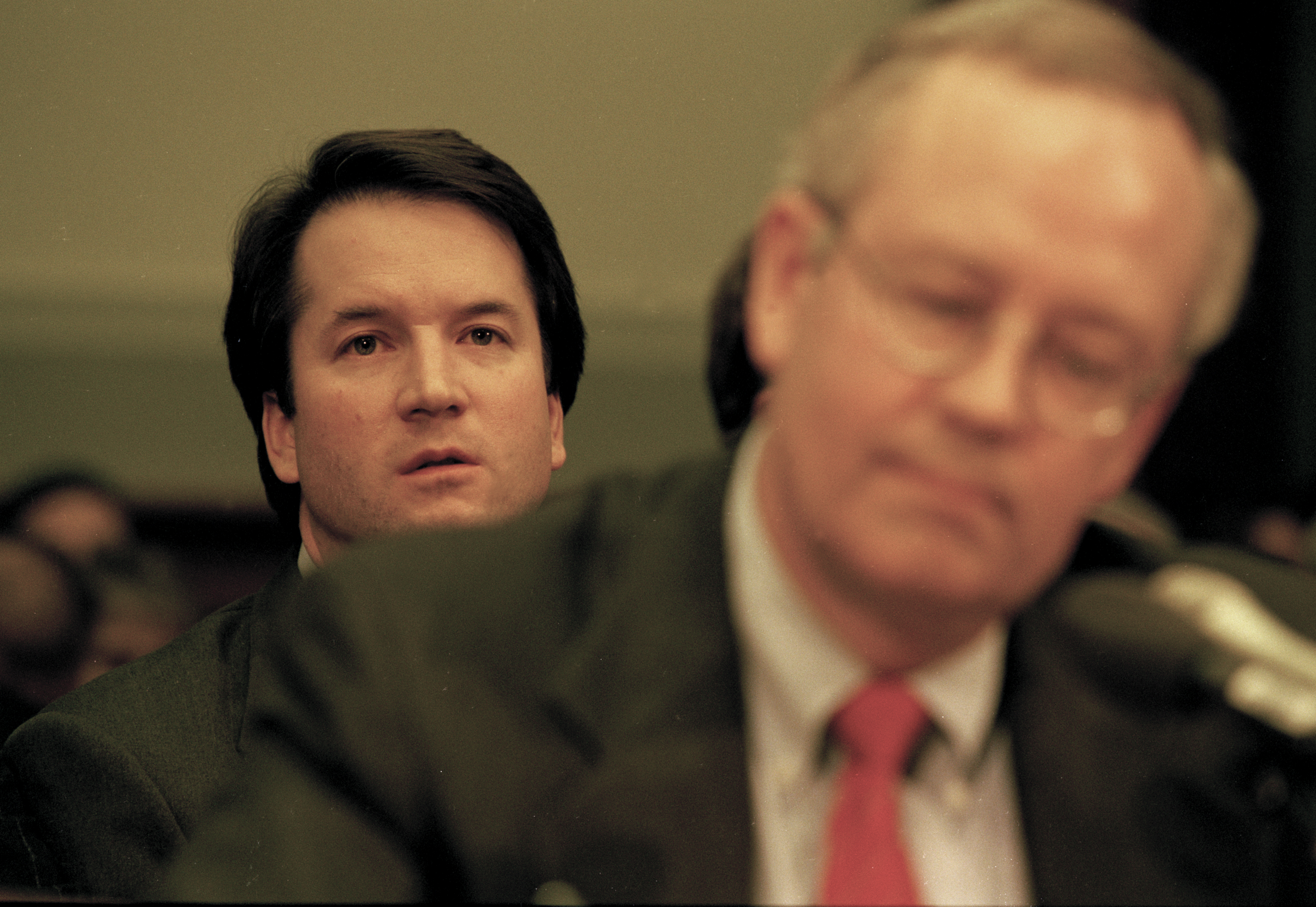 WASHINGTON DC -- NOVEMBER 19: Brett Kavanaugh, associate counsel in the Office of Independent Counsel Kenneth Starr, sits behind Starr during his testimony before the House Judiciary Committee regarding the possible impeachment of President Bill Clinton on November 19, 1998 in Washington DC. (Photo by David Hume Kennerly/Getty Images)