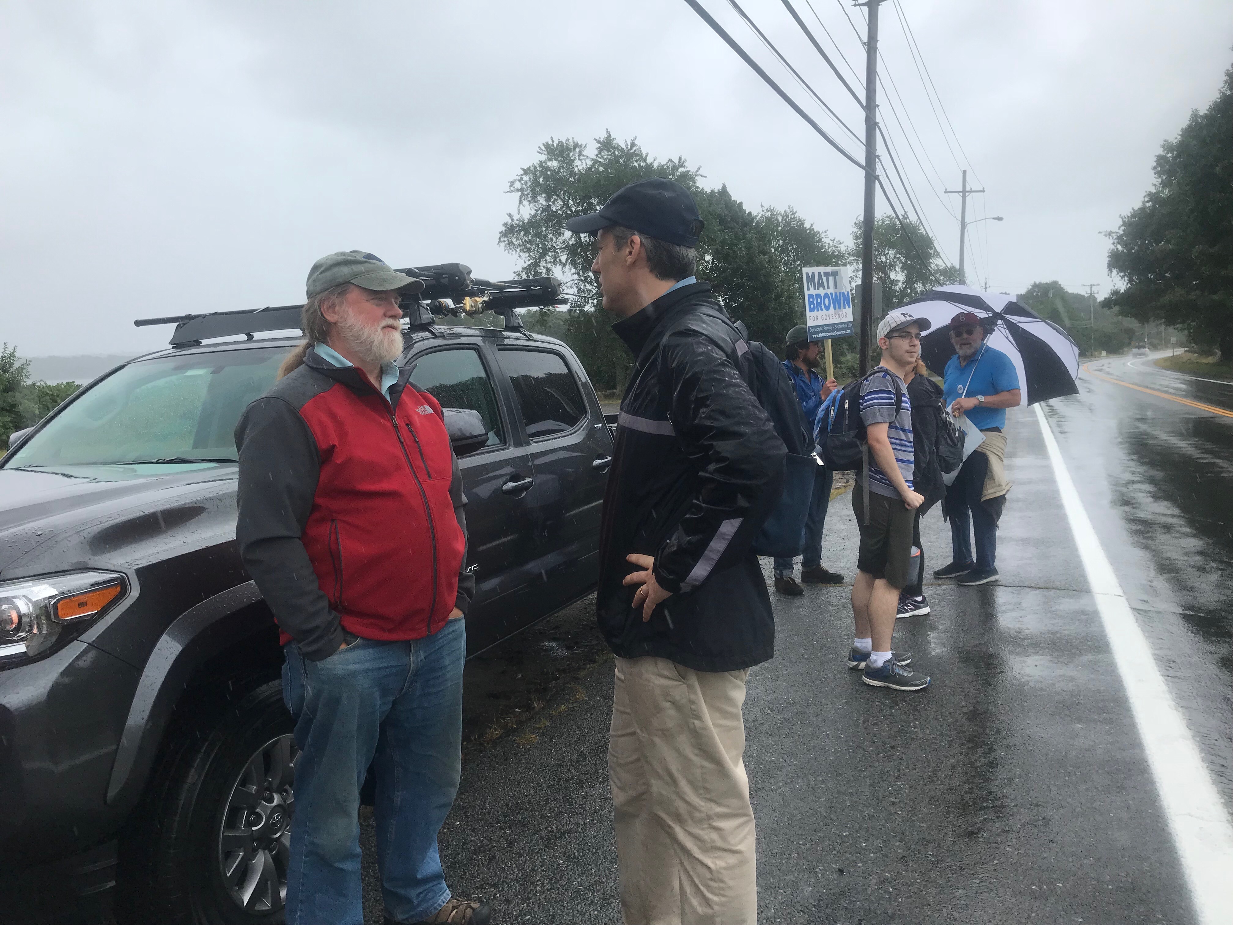 Gubernatorial candidate Matt Brown talking with resident Bob Bowen. Bowen voted for Sanders in 2016 and has been following progressive candidates ever since, which is how he learned about Brown.