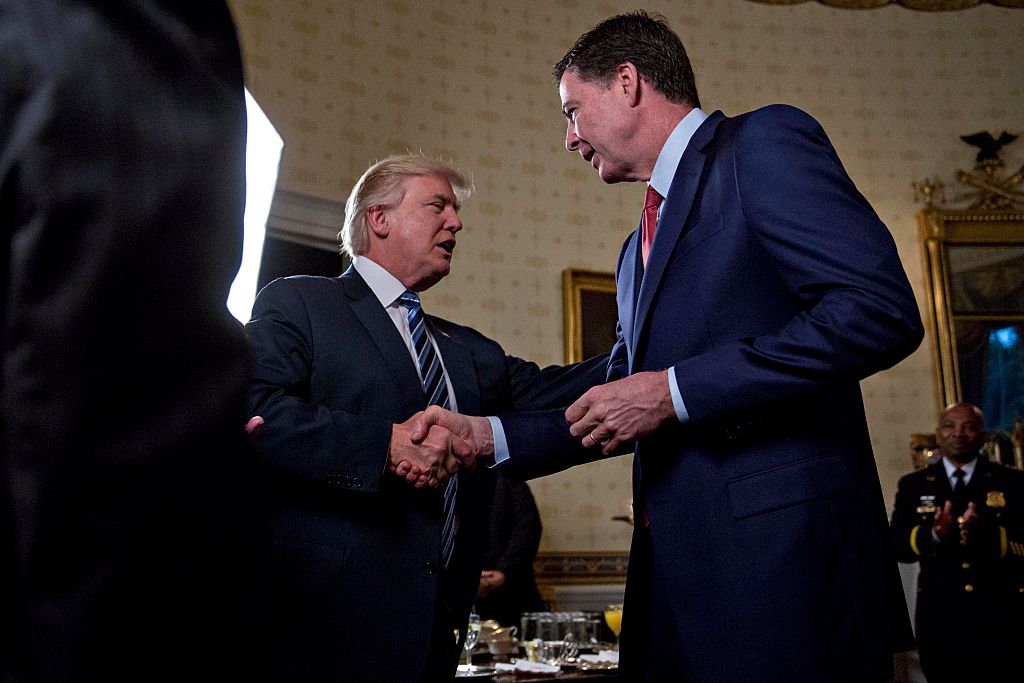 Donald Trump shakes hands with James Comey in the Blue Room of the White House on January 22, 2017. (Andrew Harrer-Pool/Getty Images)