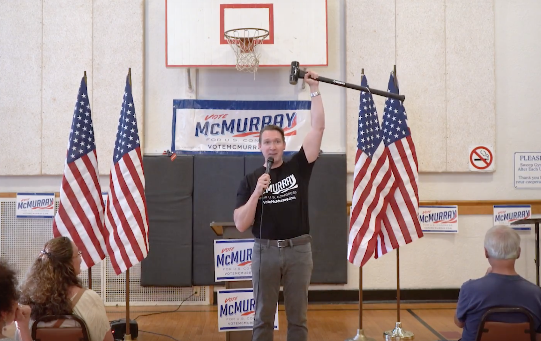 Nate McMurray and his machine-breaking hammer. (CREDIT: YOUTUBE SCREENSHOT)
