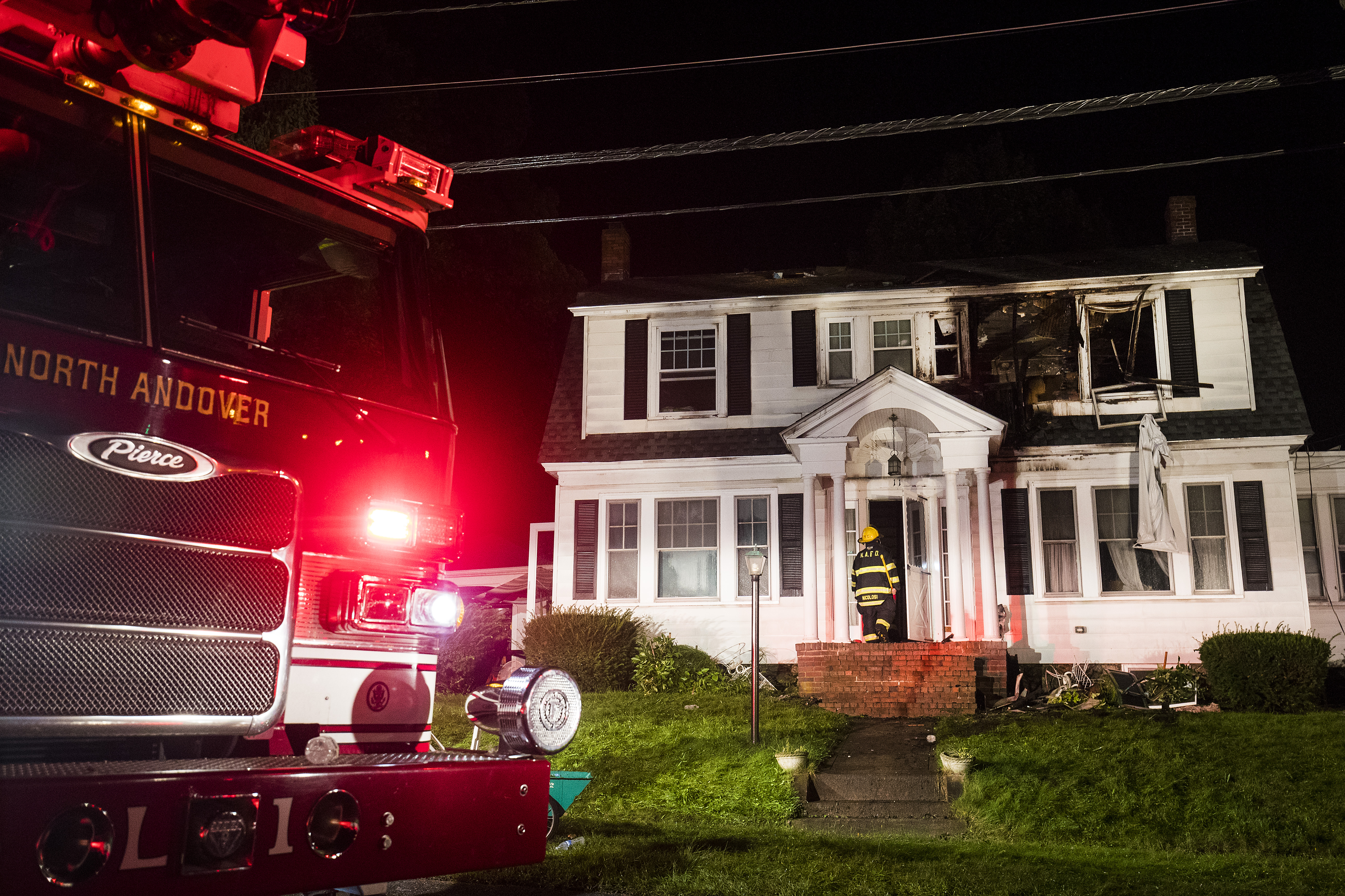 Firefighters inspect a home after gas explosions on September 13, 2018 in North Andover, Massachusetts. CREDIT: Adam Glanzman/Getty Images