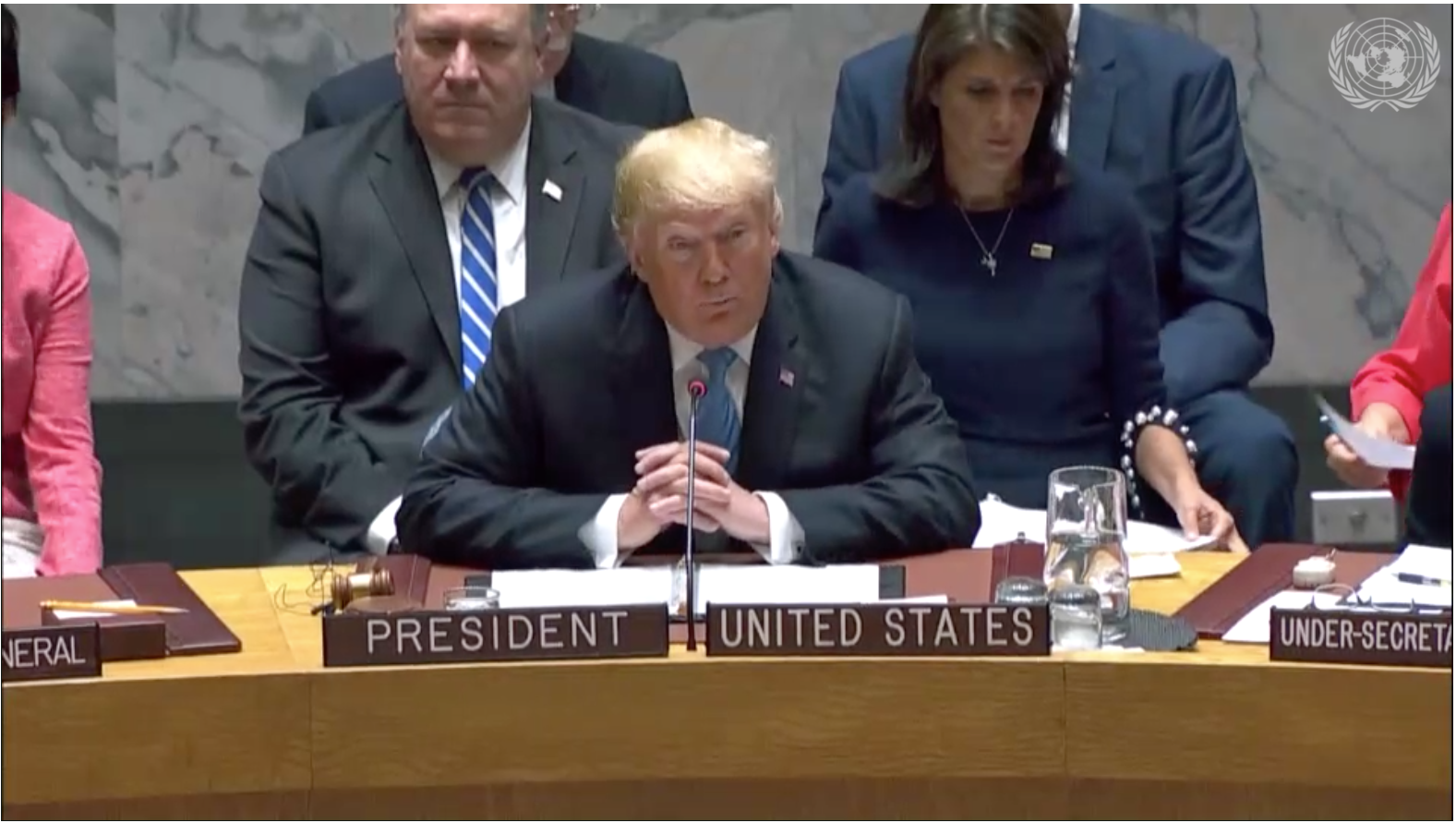 President Donald Trump, flanked by Secretary of State Mike Pompeo and U.S. ambassador to the U.N. Nikki Haley, leads a U.N. Security Council meeting in New York on Sept. 26, 2018. CREDIT: U.N. Media.