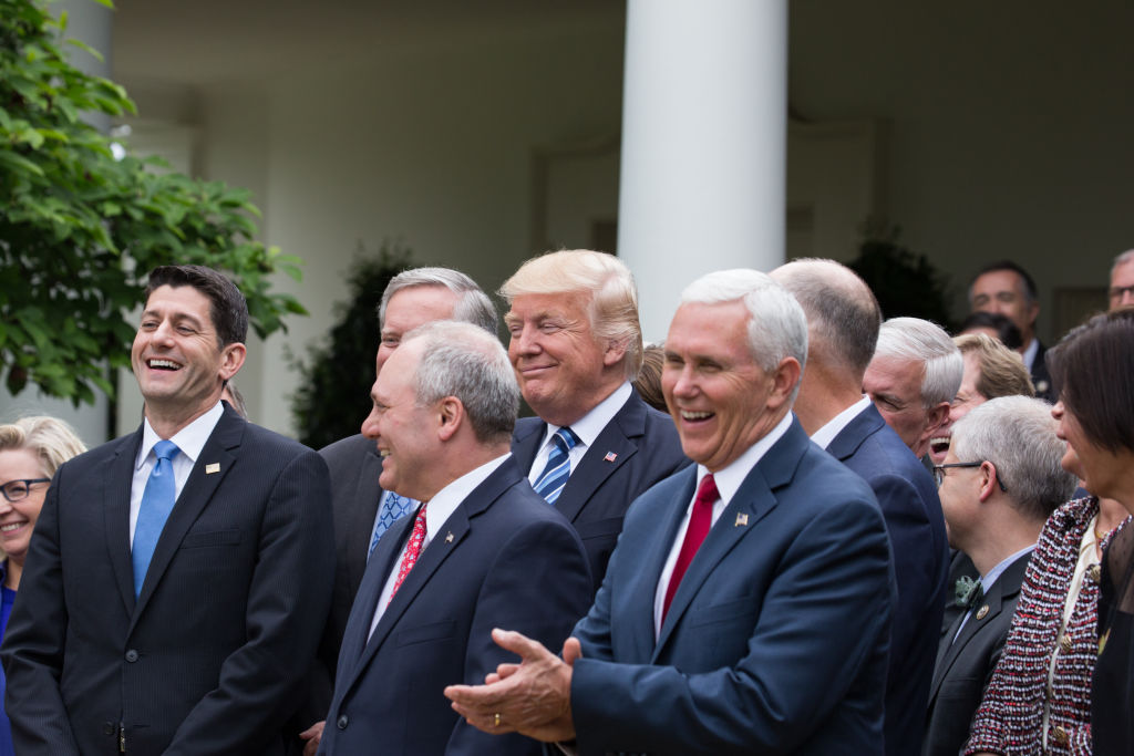 Donald Trump laughs with Republicans in the Rose Garden of the White House after the passage of legislation to roll back the Affordable Care Act on May 4, 2017. (Cheriss May/NurPhoto via Getty Images)