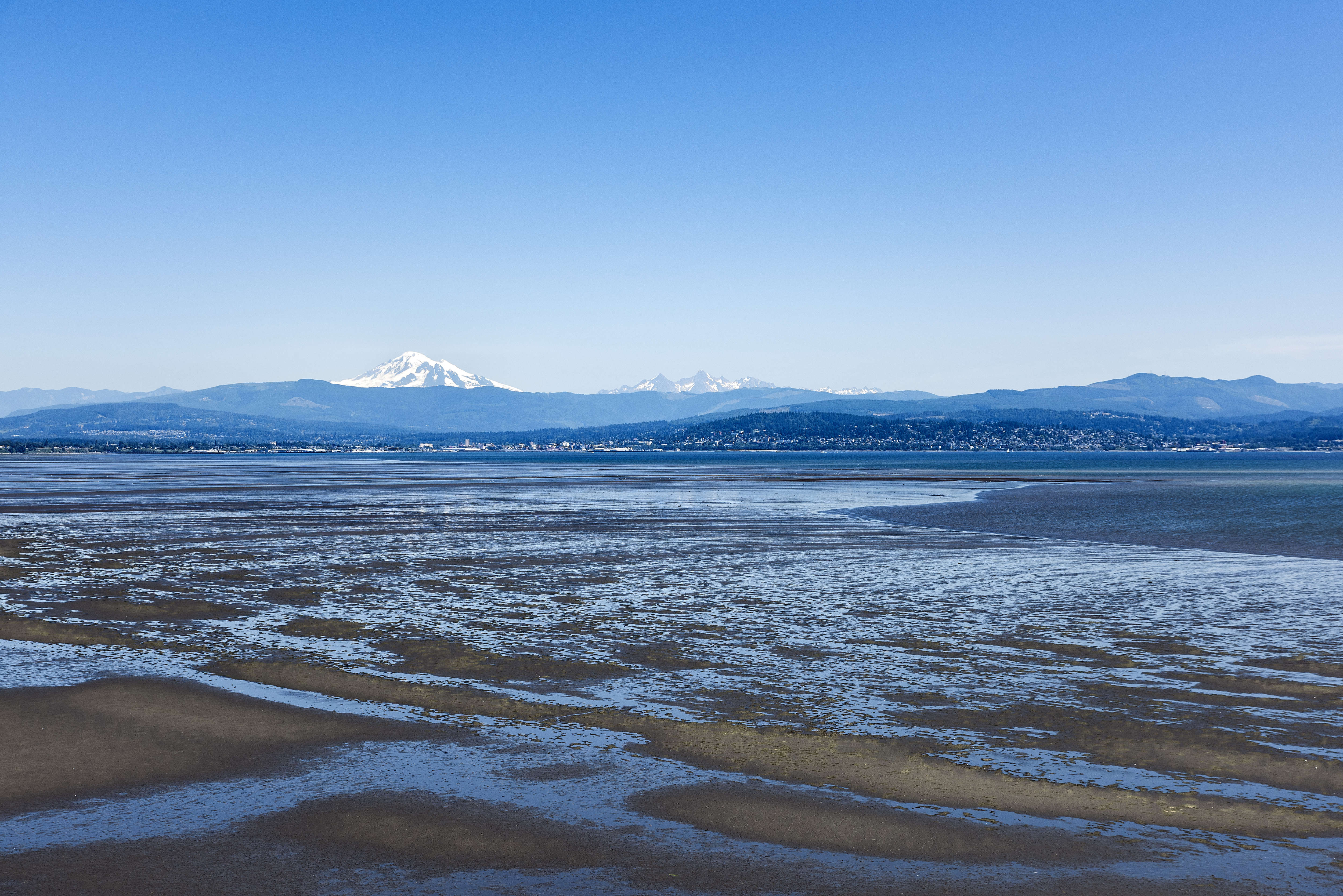 Mt. Baker and the "Sisters" across Bellingham Bay. CREDIT: John Greim/LightRocket via Getty Images