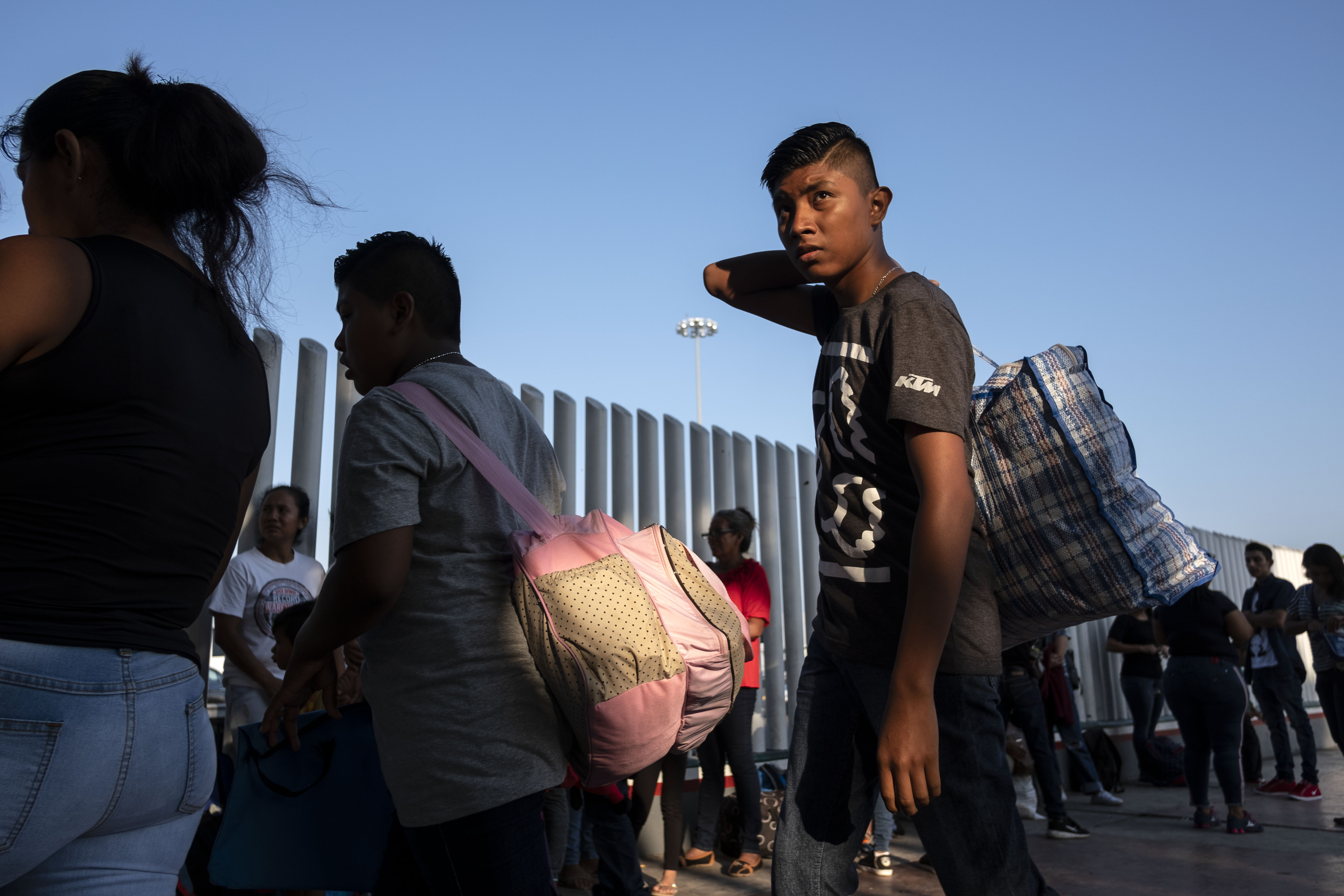 Asylum seekers gather at El Chaparral port of entry in Tijuana, Baja California state, Mexico on August 10, 2018, as they look for an appointment to present their asylum request before the United States authorities. - From the south border with Guatemala to the north border with the United States, AFP met during 24 hours migrants in pursue of their "American dream" risking their lives though Mexican territory, who share their journey stories. (GUILLERMO ARIAS/AFP/Getty Images)