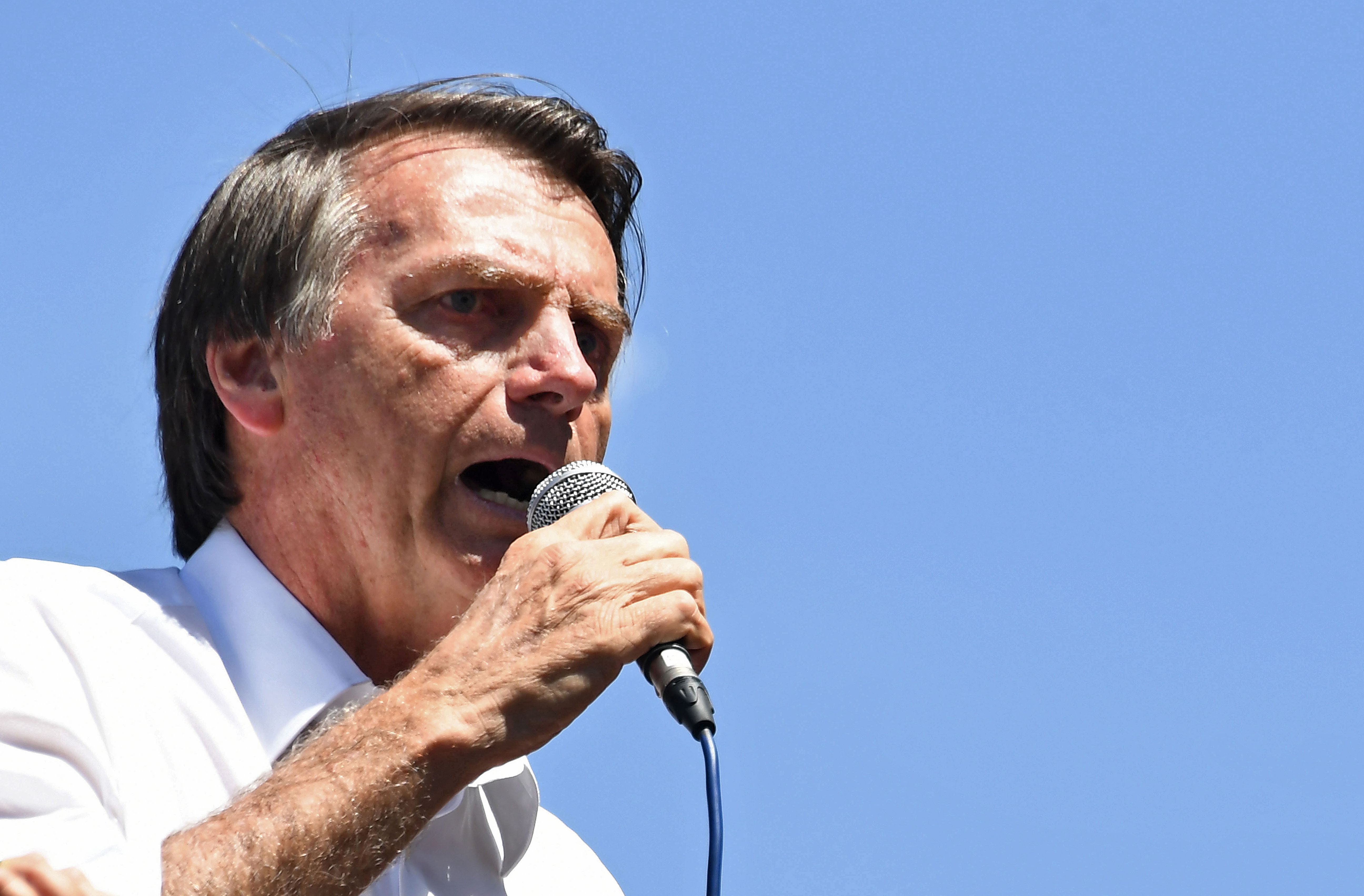 Brazilian right-wing presidential candidate Jair Bolsonaro speaks during a campaign rally in the district of Ceilandia in Brasilia, on September 5, 2018. - Brazil will hold presidential elections on October 7. (Photo by EVARISTO SA / AFP) (Photo credit should read EVARISTO SA/AFP/Getty Images)