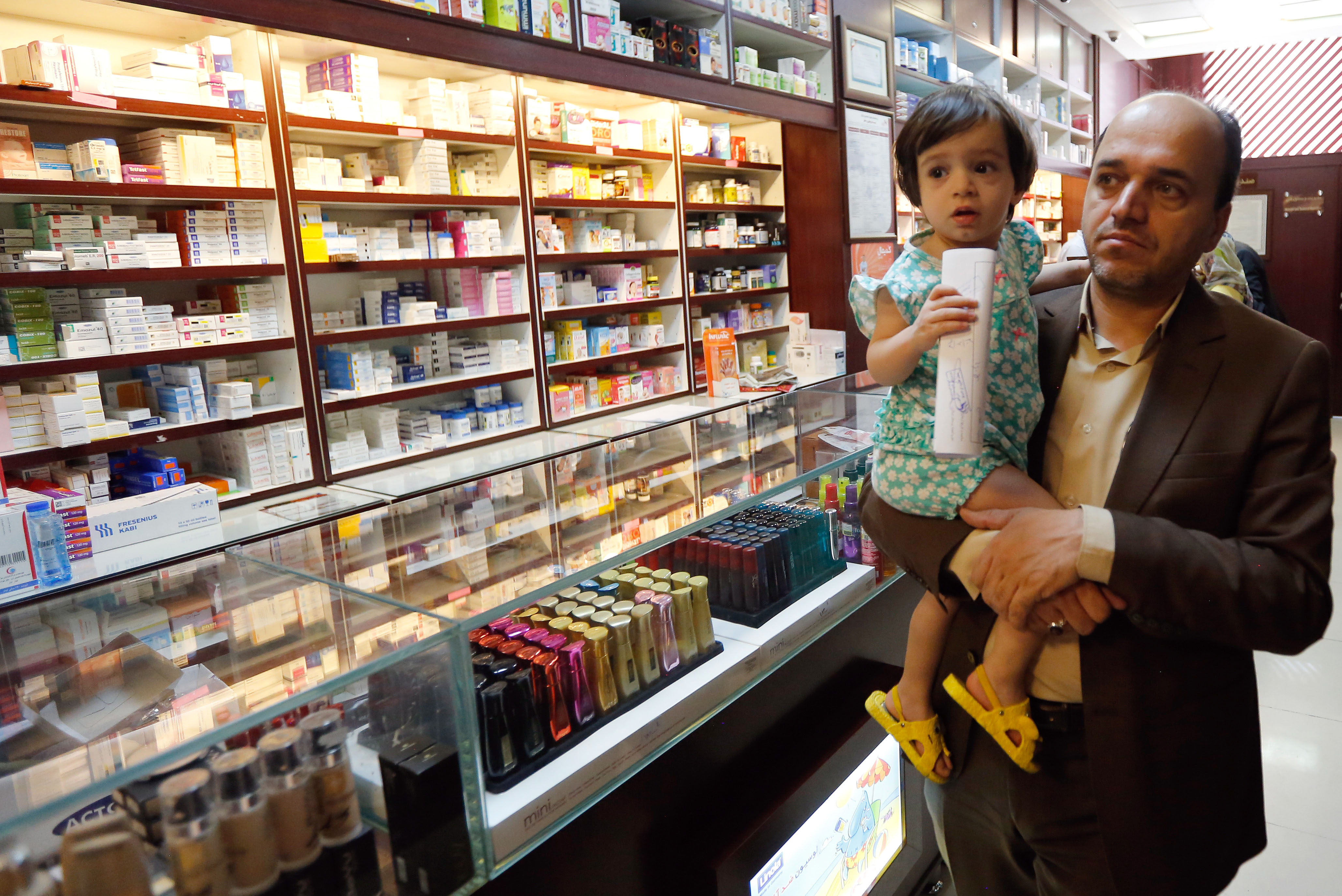 An Iranian man shops at a drugstore at the Nikan hospital in Tehran on September 11, 2018. Iran produces 96 percent of the drugs it uses, according to the Syndicate of Iranian Pharmaceutical Industries, but imports more than half the raw materials to make them. CREDIT: Stringer/AFP/Getty Images.