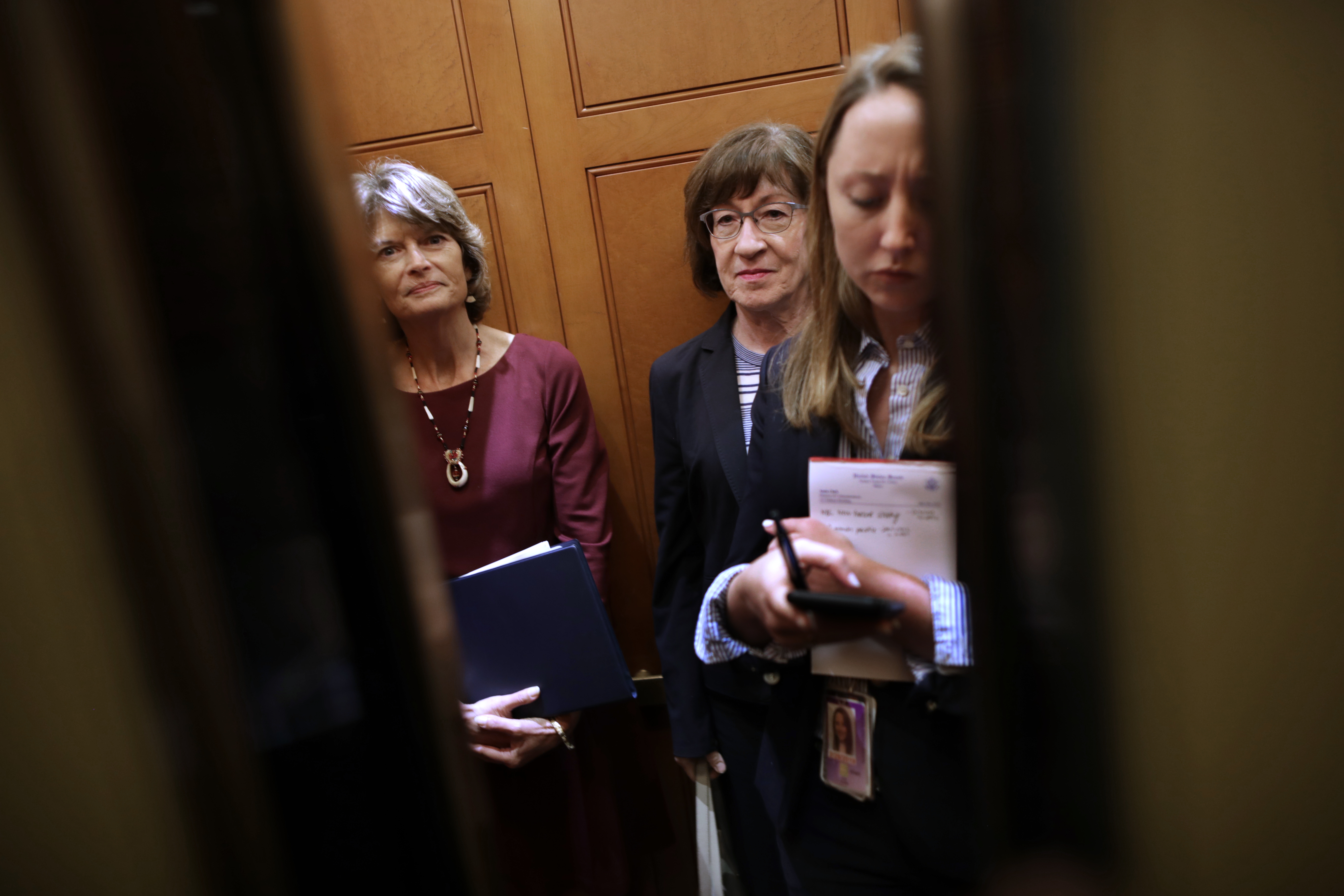 WASHINGTON, DC - OCTOBER 02: Sen. Lisa Murkowski (R-AK) (L) and Sen. Susan Collins (R-ME) share an elevator as they head for the weekly Senate Republican policy luncheon at the U.S. Capitol October 02, 2018 in Washington, DC. Senate GOP leaders agreed last week with the Judiciary Committee to allow the FBI to conduct a one-week investigation into sexual assault allegations against Supreme Court nominee Judge Brett Kavanaugh before the Senate votes on his confirmation. (Photo by Chip Somodevilla/Getty Images)