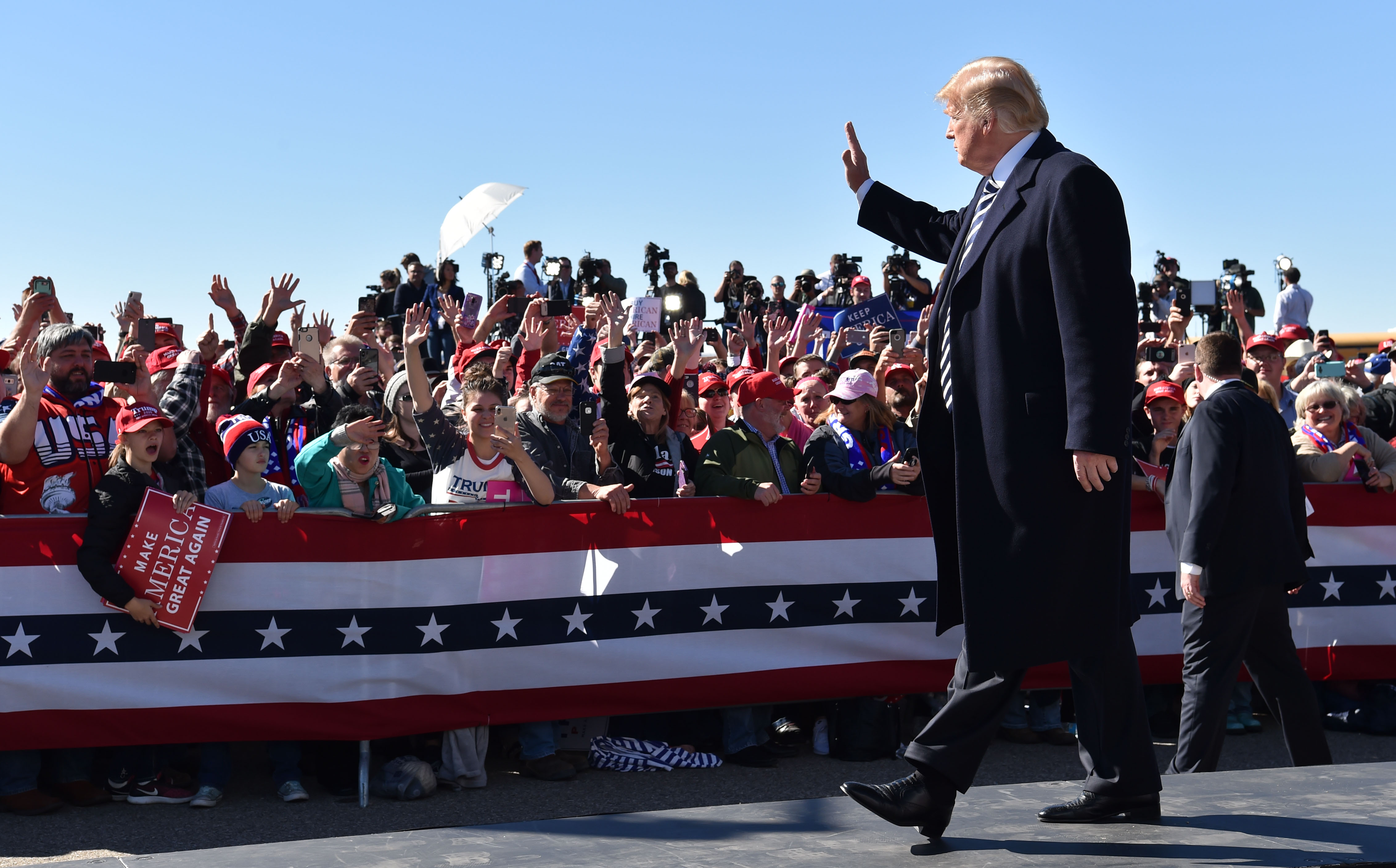 US President Donald Trump arrives for a "Make America Great Again" rally at Elko Regional Airport in Elko, Nevada, October 20, 2018. (Photo by Nicholas Kamm / AFP / Getty Images)