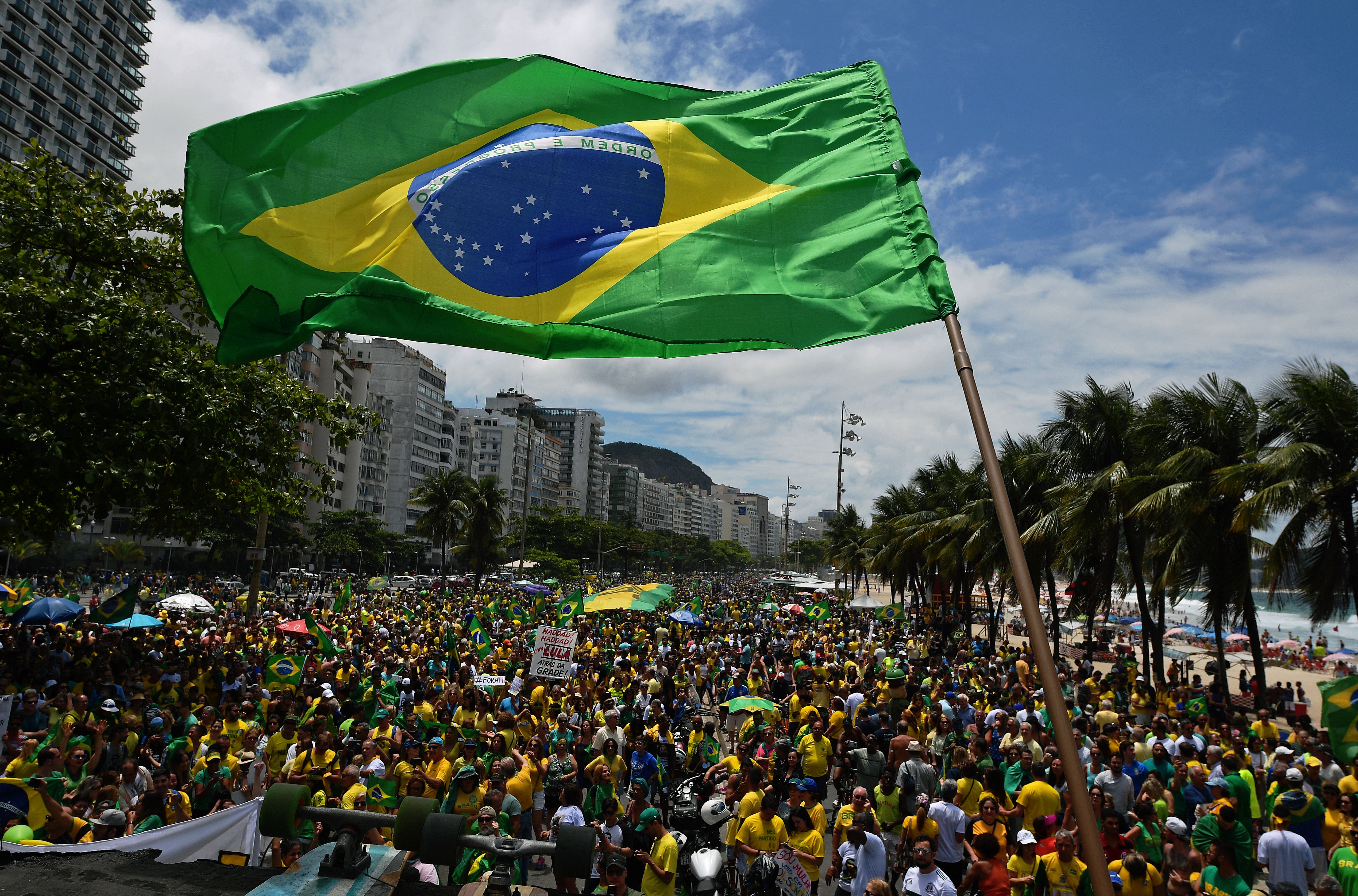 Supporters of Brazilian far-right presidential candidate Jair Bolsonaro attend a rally in Copacabana beach, Rio de Janeiro, Brazil, on October 21, 2018. CREDIT: CARL DE SOUZA/AFP/Getty Images