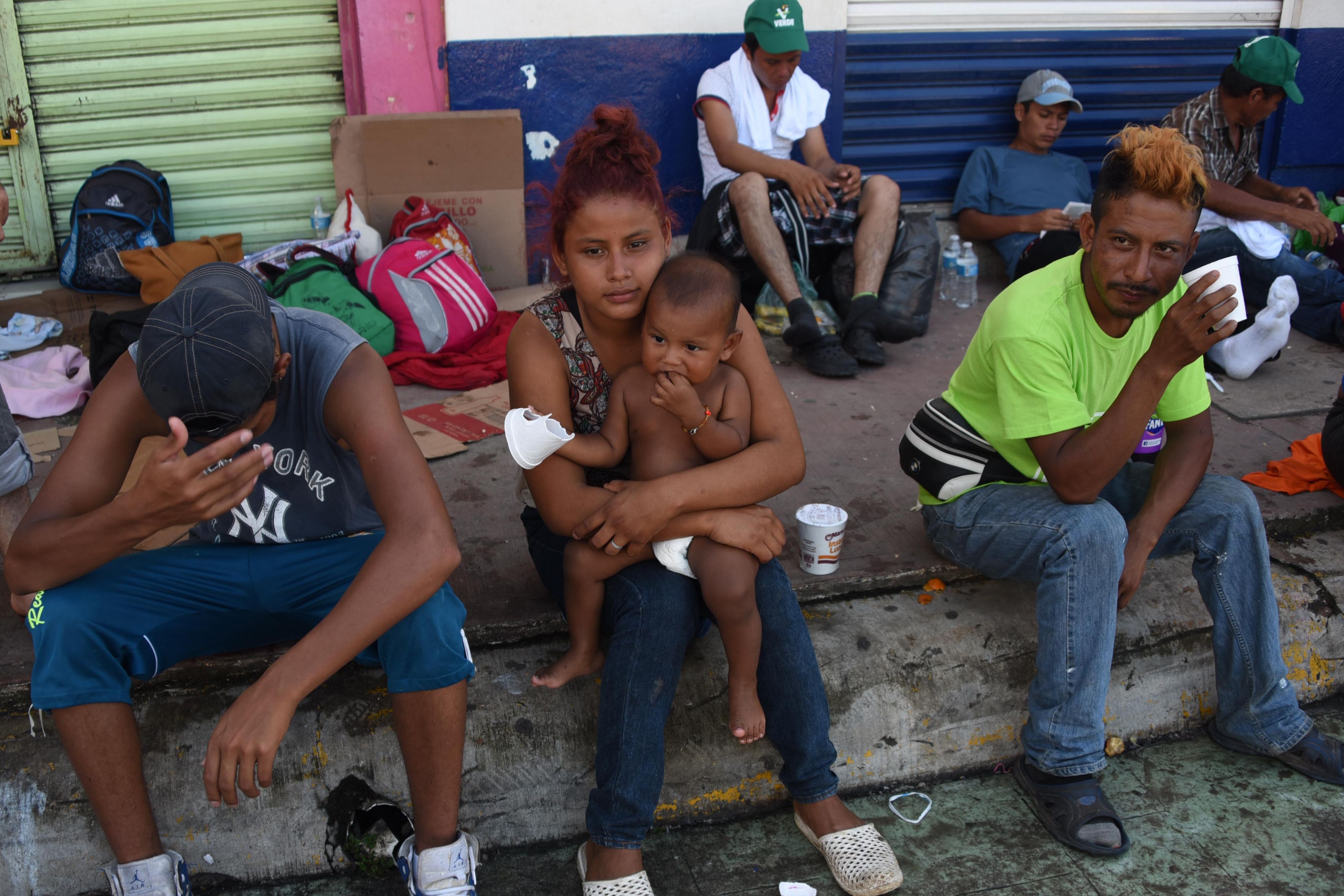 Honduran migrants taking part in a caravan heading to the US, rest during a stop in their journey, in Huixtla, Chiapas state, Mexico, on October 23, 2018. CREDIT: Johan Ordonez/AFP/Getty Images.