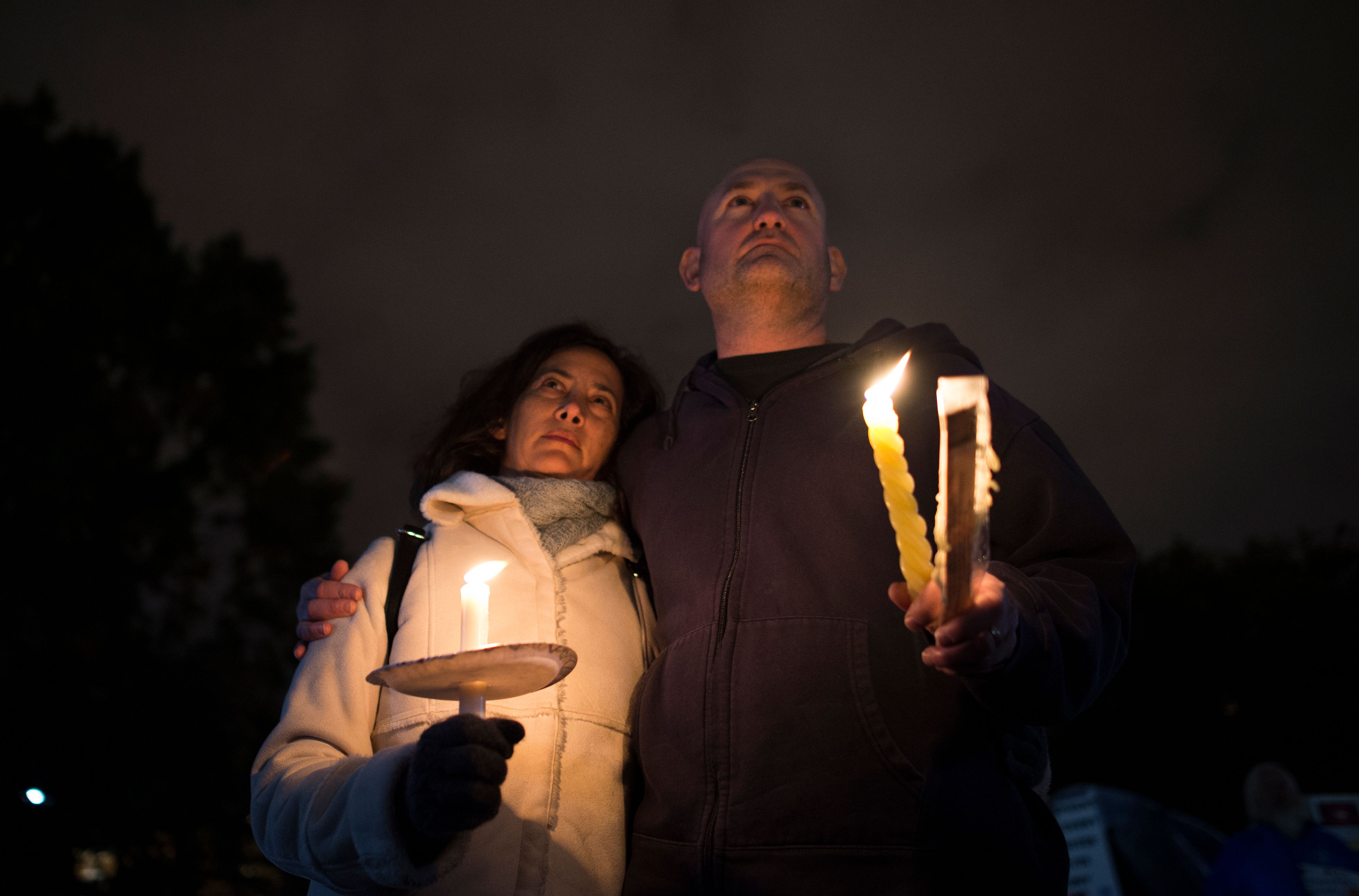 Members and supporters of the Jewish community come together for a candlelight vigil, in remembrance of those who died earlier in the day during a shooting at the Tree of Life Synagogue in the Squirrel Hill neighborhood of Pittsburgh, in front of the White House in Washington, DC on October 27, 2018. - A heavily armed gunman opened fire during a baby-naming ceremony at a synagogue in the US city of Pittsburgh on October 27, killing 11 people and injuring six in the deadliest anti-Semitic attack in recent American history. (Photo by ANDREW CABALLERO-REYNOLDS / AFP) (Photo credit should read ANDREW CABALLERO-REYNOLDS/AFP/Getty Images)