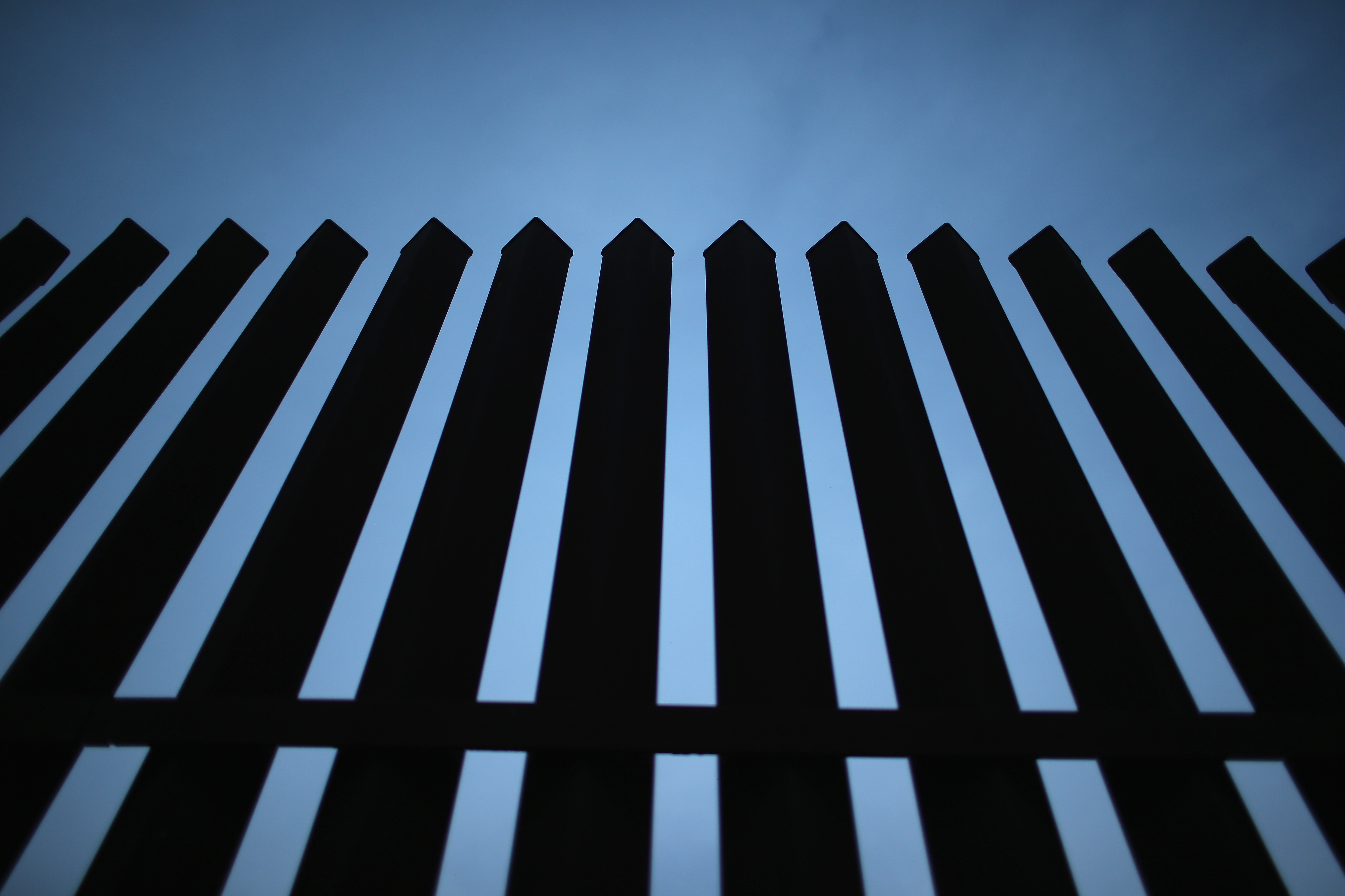 MCALLEN, TX - DECEMBER 08: The U.S.-Mexico border fence stands on December 8, 2015 near McAllen, Texas. The number of migrant families and unaccompanied minors has again surged in recent months, even as the total number of illegal crossings nationwide has gone down over the previous year. (Photo by John Moore/Getty Images)