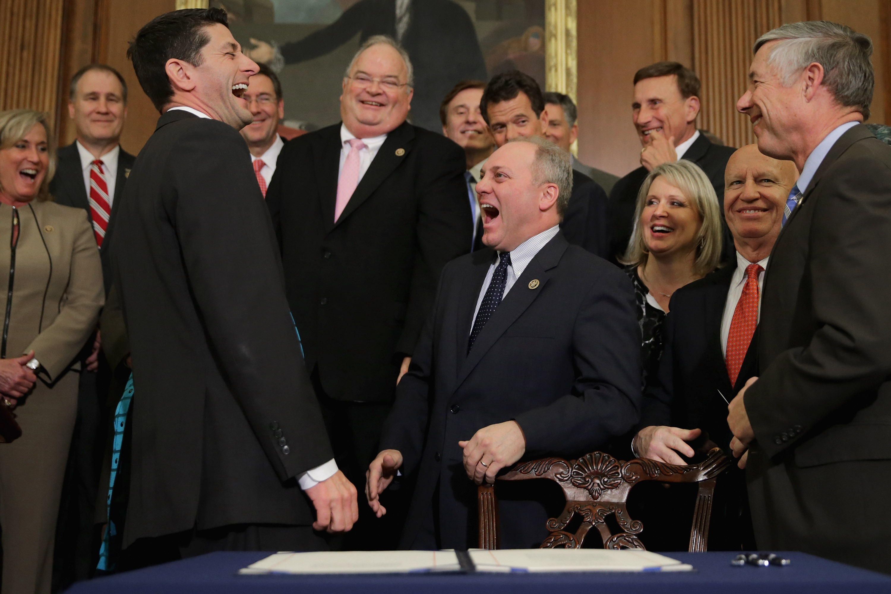 Republicans celebrate after one of the many times they passed legislation that would have stripped health care from millions of Americans. (Photo CREDIT: Chip Somodevilla/Getty Images)