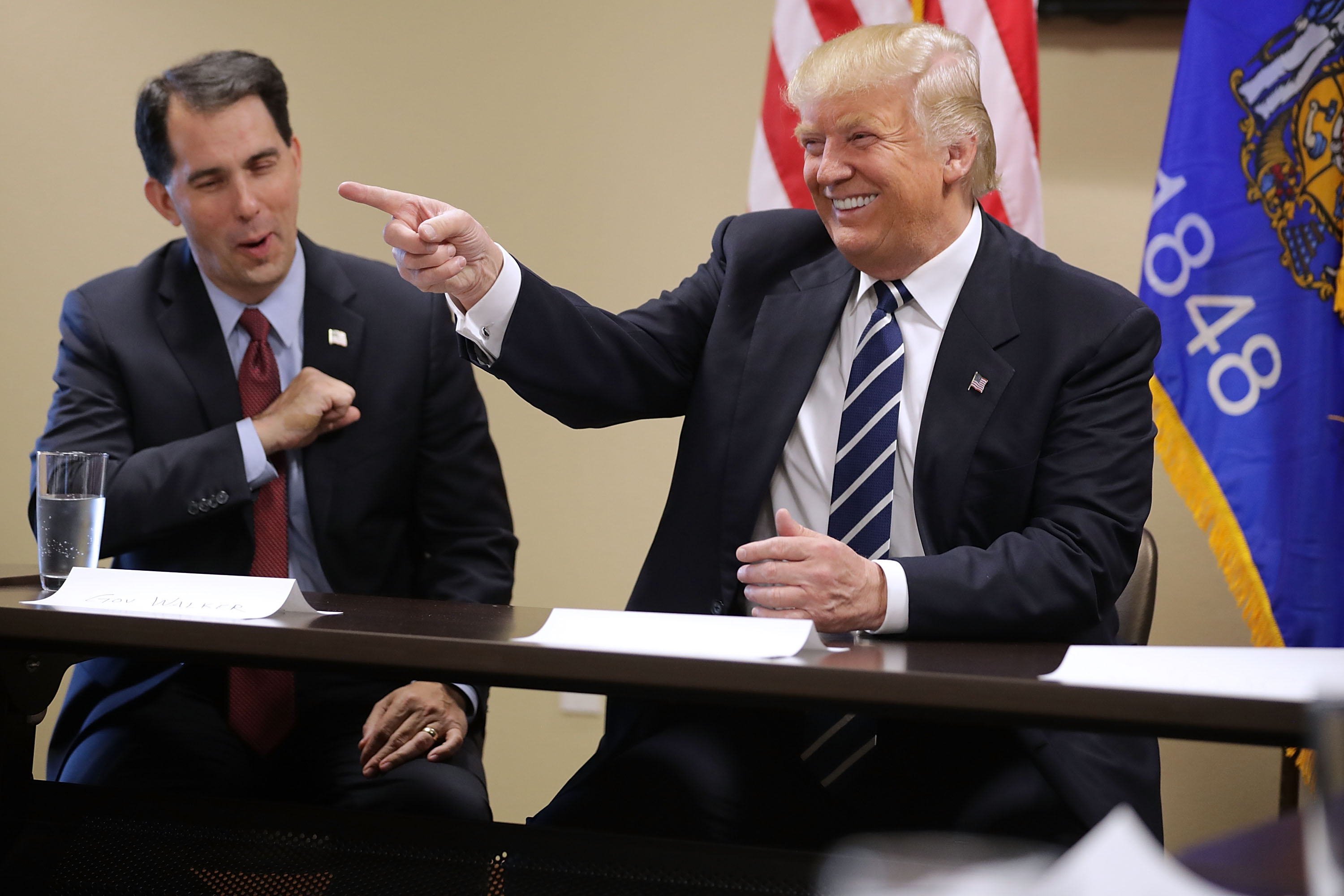 ALTOONA, WI - NOVEMBER 01: Republican presidential nominee Donald Trump (R) sits down with Wisconsin Governor Scott Walker and a group of invited small business owners for a round table meeting at the Staybridge Suites November 1, 2016 in Altoona, Wisconsin. After sitting down, Trump immediately began to talk about poll numbers and former Indiana University basketball coach Bobby Knight told a joke. (Photo by Chip Somodevilla/Getty Images)
