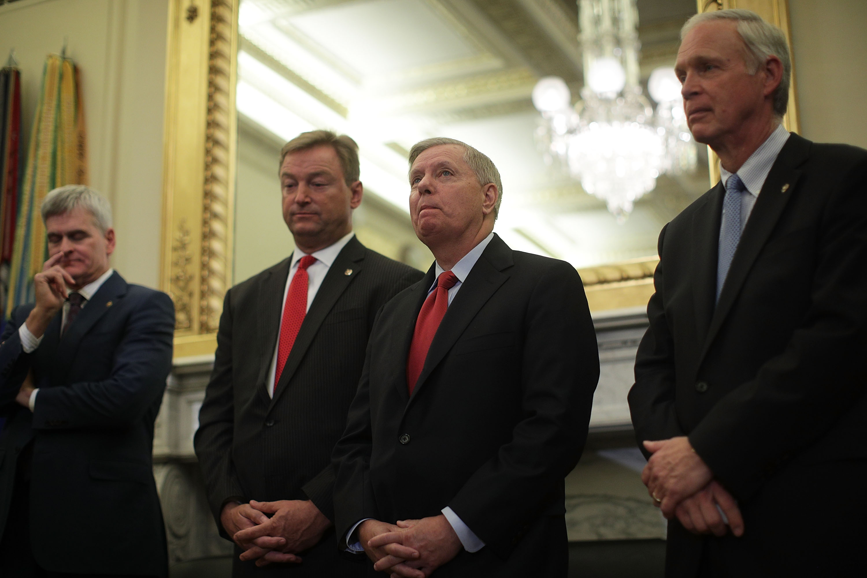 Sens. Bill Cassidy (R-LA), Dean Heller (R-NV), Lindsey Graham (R-SC) and Ron Johnson (R-WI) attend a news conference on health care September 13, 2017 on Capitol Hill in Washington, DC. (Credit: Alex Wong/Getty Images)