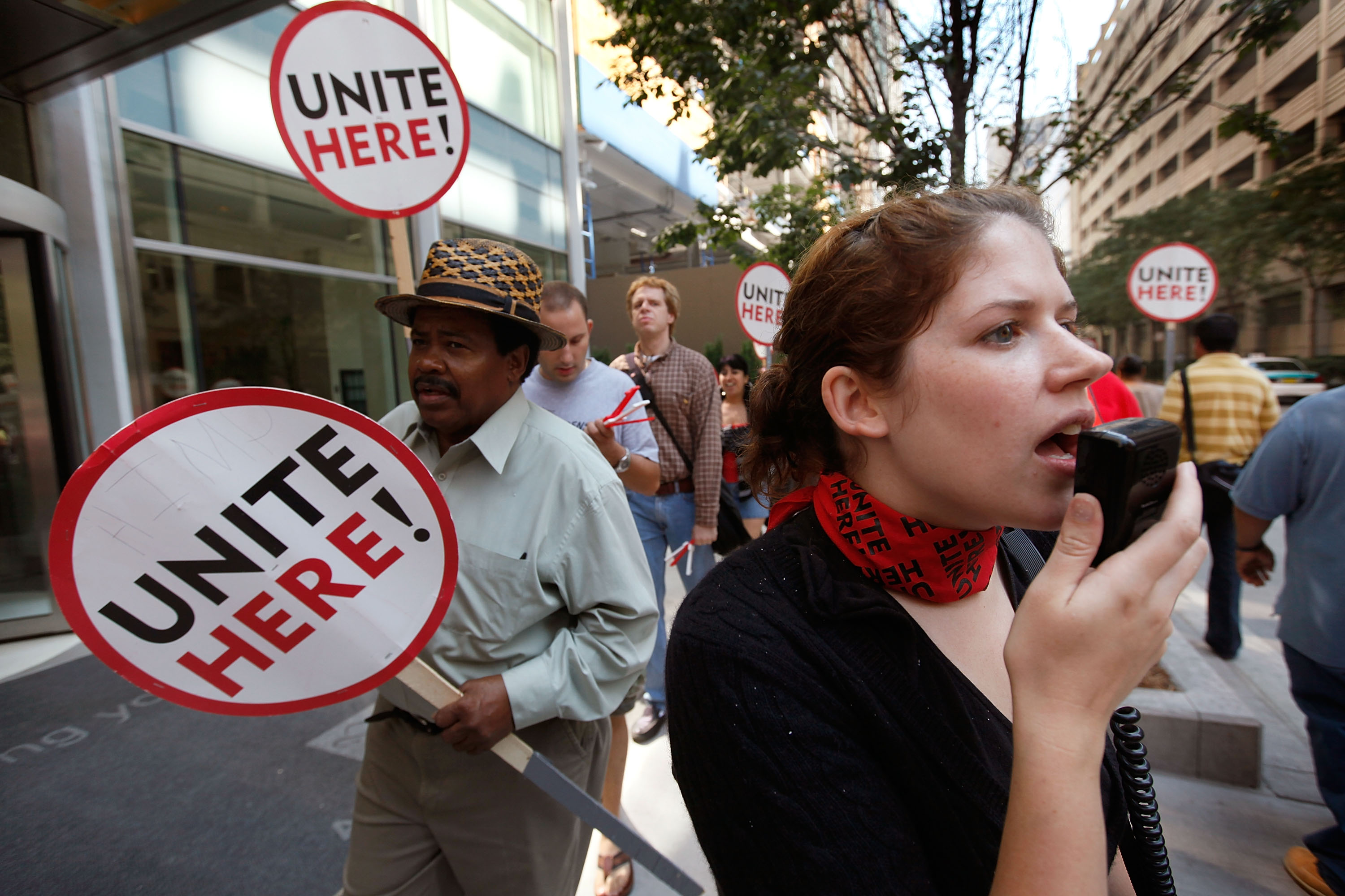 Carrie Sallgren leads hotel workers in a chant as they picket outside the Affinia hotel September 11, 2009 in Chicago, Illinois. Unite Local 1 represents about 6,500 Chicago hotel workers. (Photo Credit: Scott Olson/Getty Images)