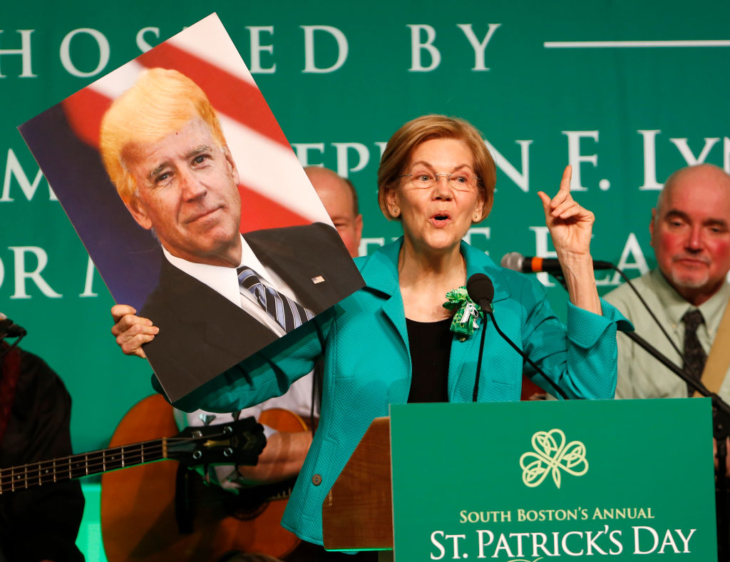 Sen. Elizabeth Warren (D-MA) holds up a picture of Joe Biden with Donald Trump's hair